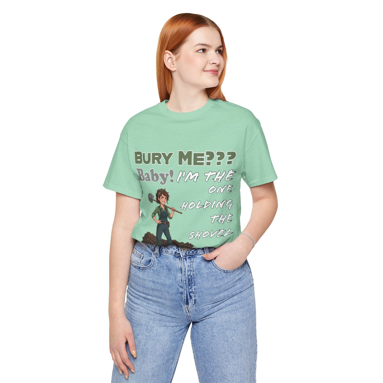 Mint green t-shirt featuring an illustrated character with a shovel and the text "Bury Me??? Baby! I'm the One Holding the Shovel"
