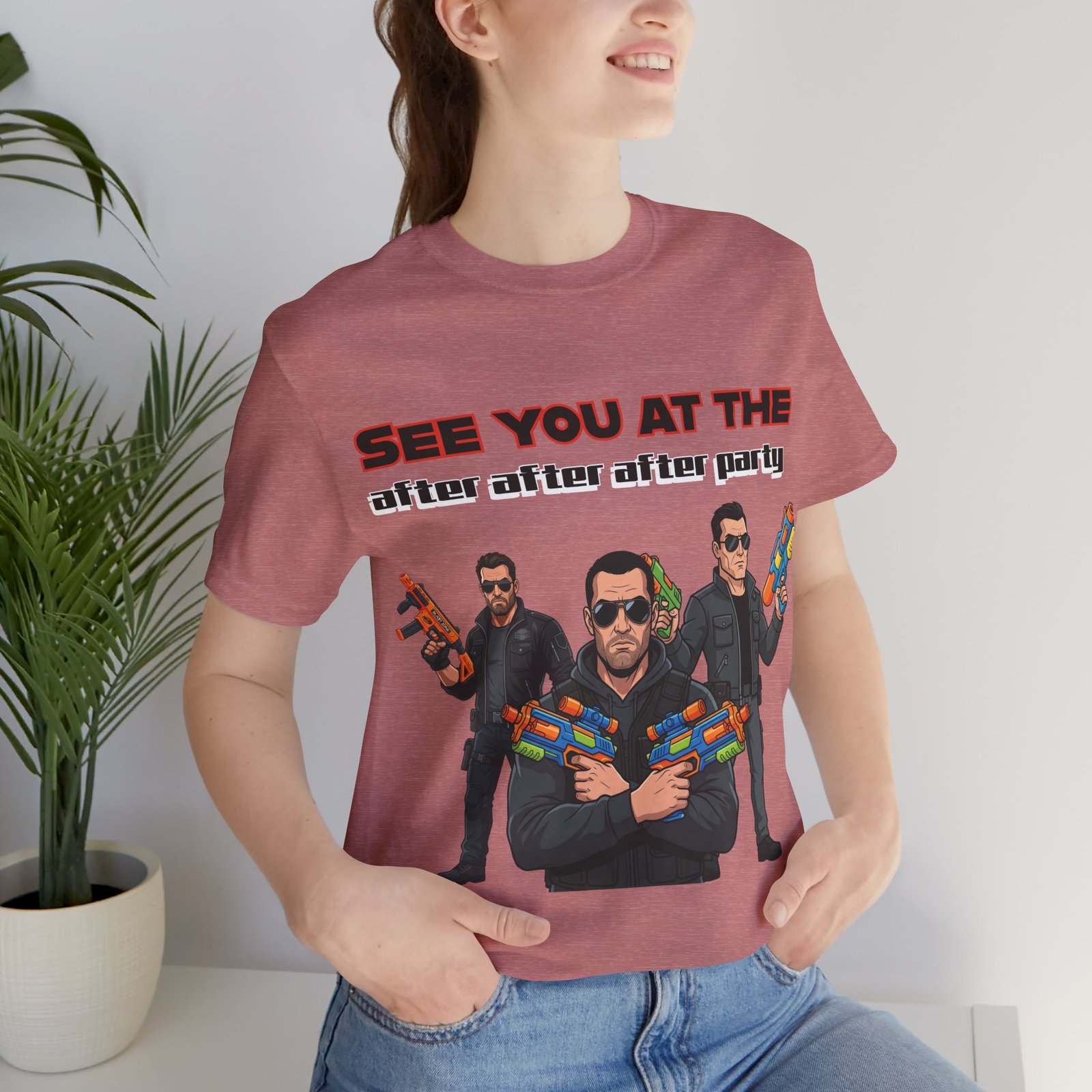 A pink t-shirt featuring three characters in sunglasses brandishing colorful water guns and the text SEE YOU AT THE after after after party