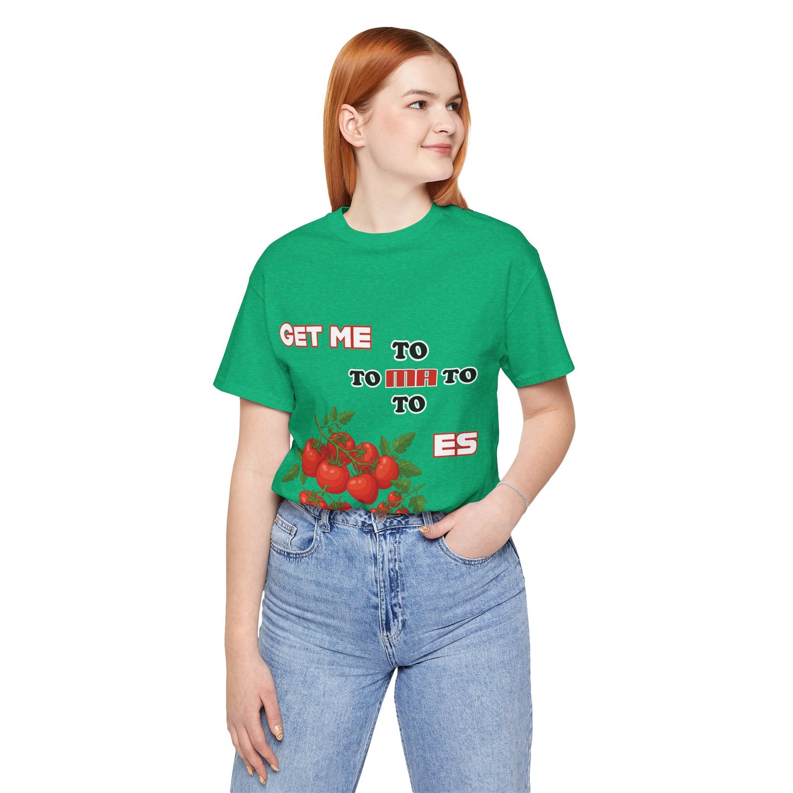 A woman wearing a green crew neck t-shirt with a vintage tomato graphic and the phrase 'Get Me To Ma To Toes'.