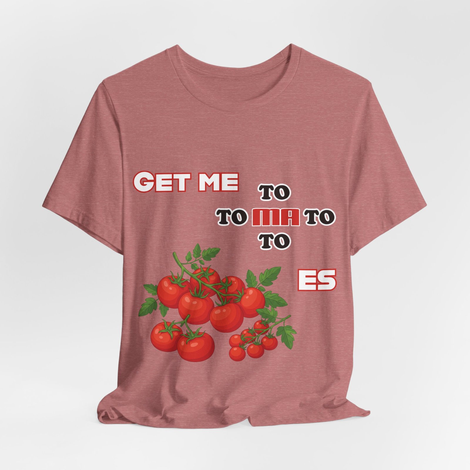 Dusty rose t-shirt featuring a fragmented "Get Me To Ma To Toes" text and a vibrant cluster of illustrated red tomatoes.