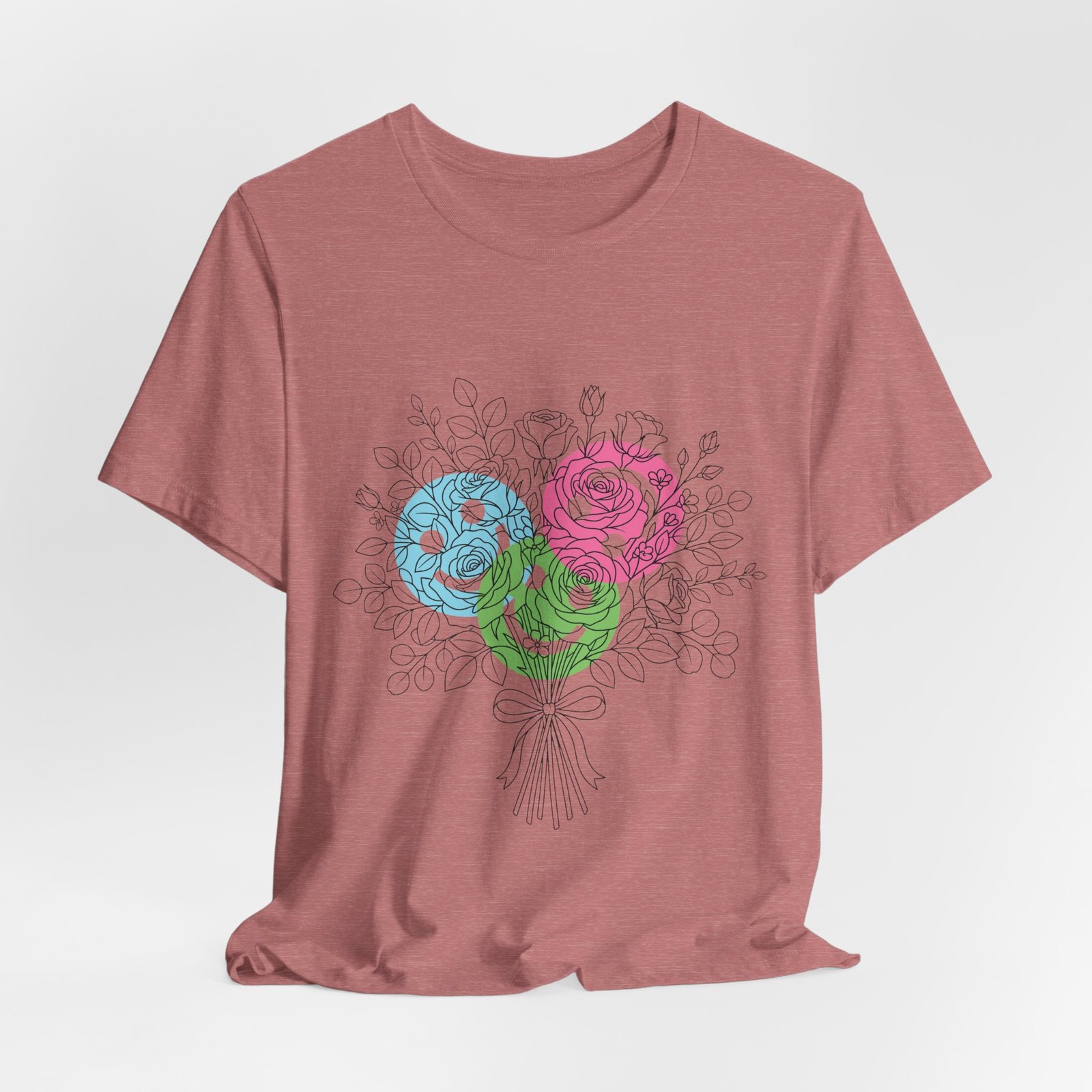 Dusty rose t-shirt featuring a hand-drawn bouquet with teal, magenta, and lime floral blooms.