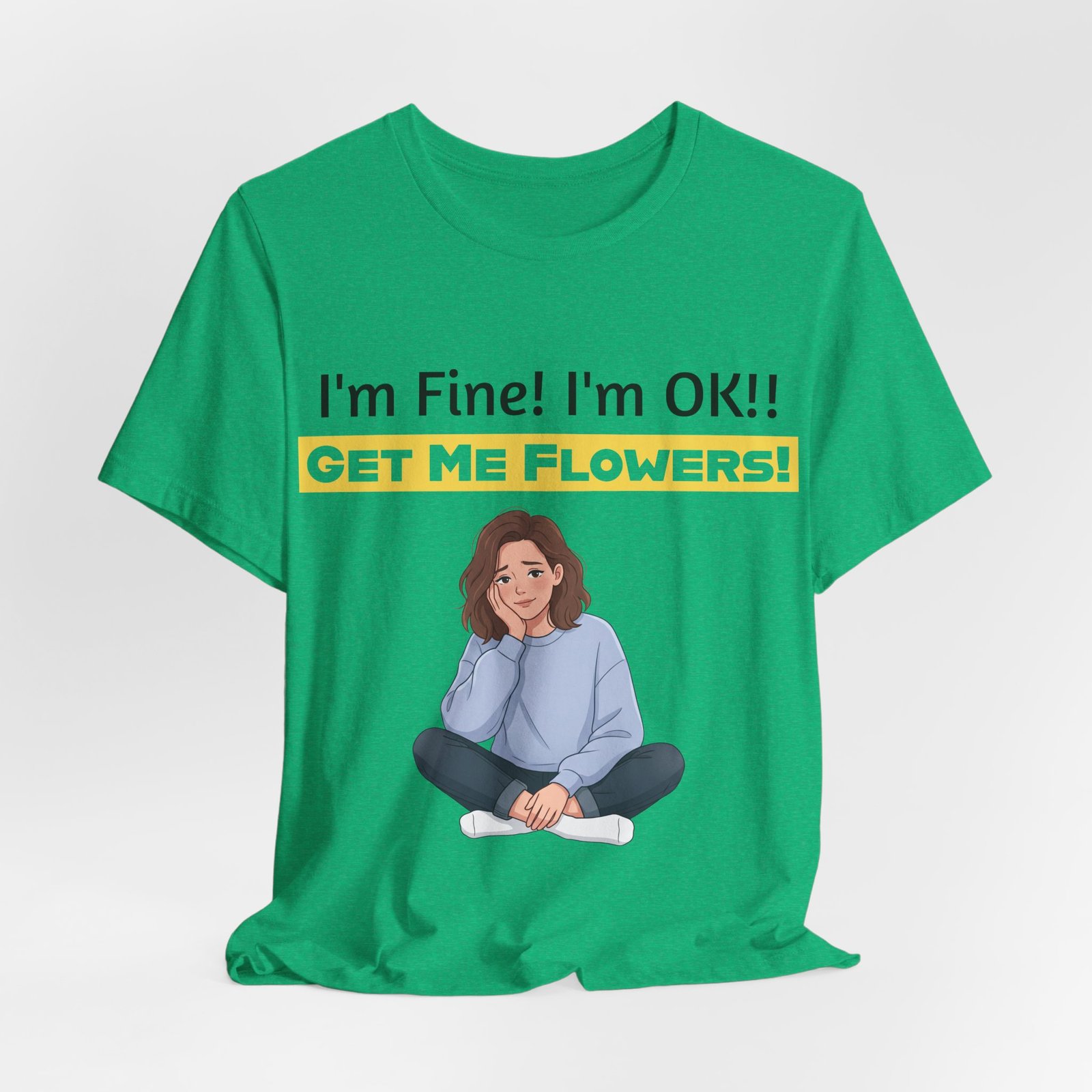Green t-shirt featuring a cartoon girl sitting pensively with text: I'm Fine! I'm OK!! GET ME FLOWERS!