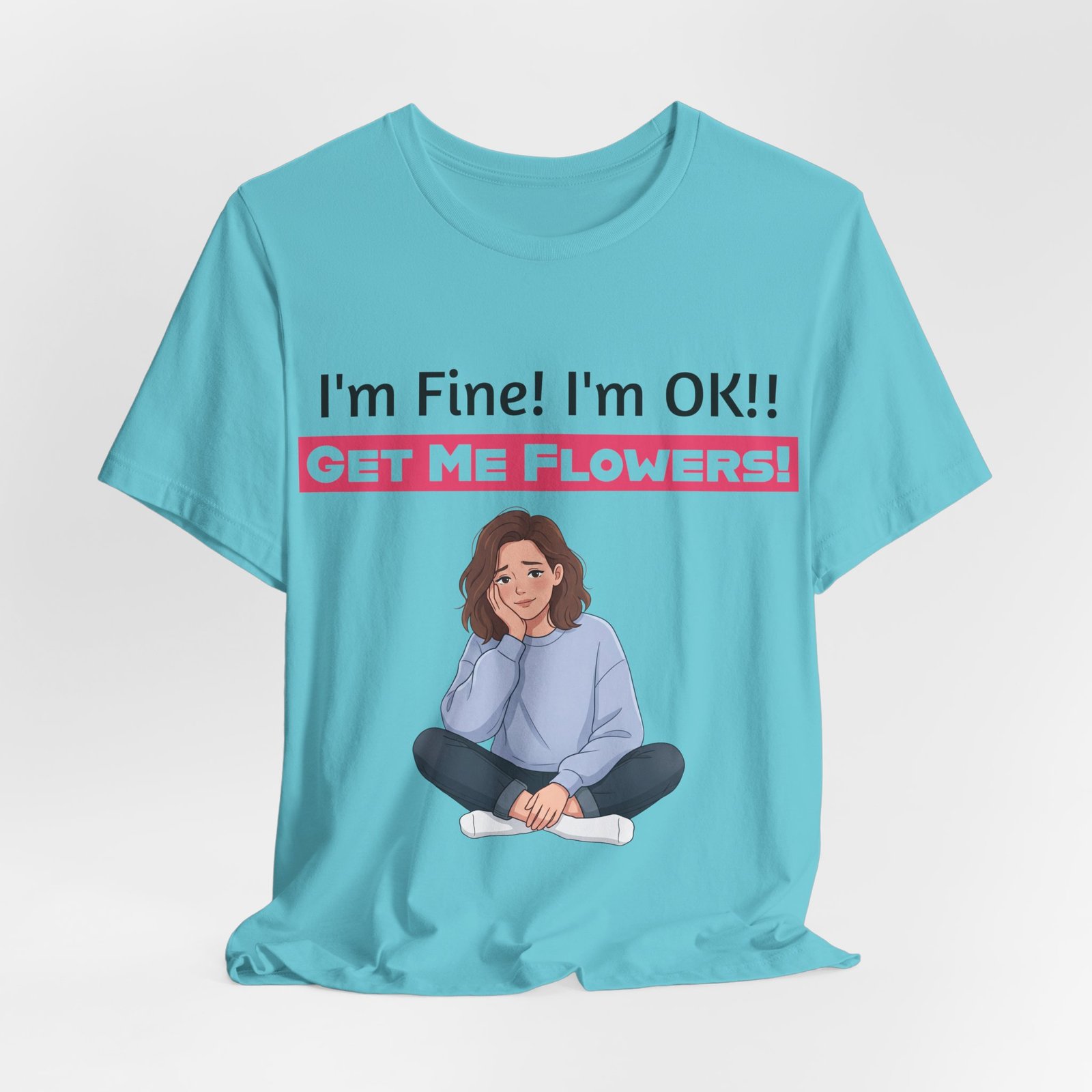Light blue funny t-shirt with text "I'm Fine! I'm OK!! GET ME FLOWERS!" and a cartoon illustration of a seated person.