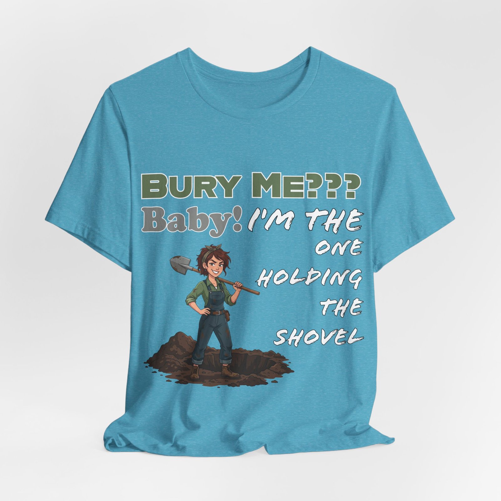Light blue t-shirt featuring a dark humor graphic with an illustrated character holding a shovel and text "BURY ME??? Baby! I'm the One Holding the Shovel"