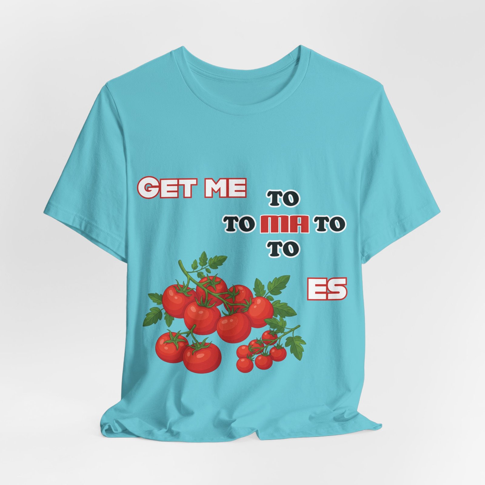 Light blue t-shirt featuring the punny phrase 'GET ME TO MA TO TOES' with a cluster of bright red tomatoes.