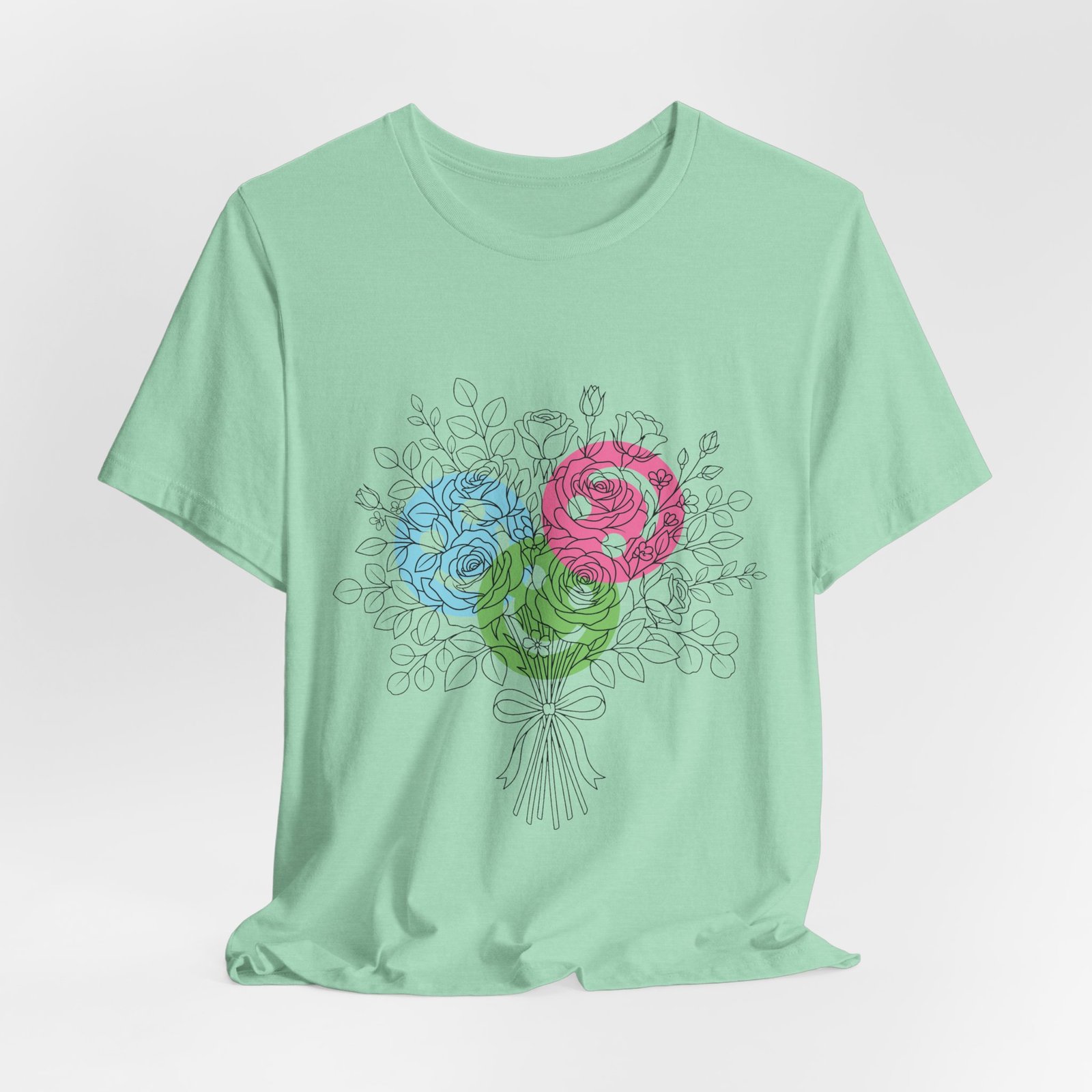 Light green t-shirt featuring a hand-drawn bouquet of colorful teal, magenta, and lime spiral yarn flower blooms.