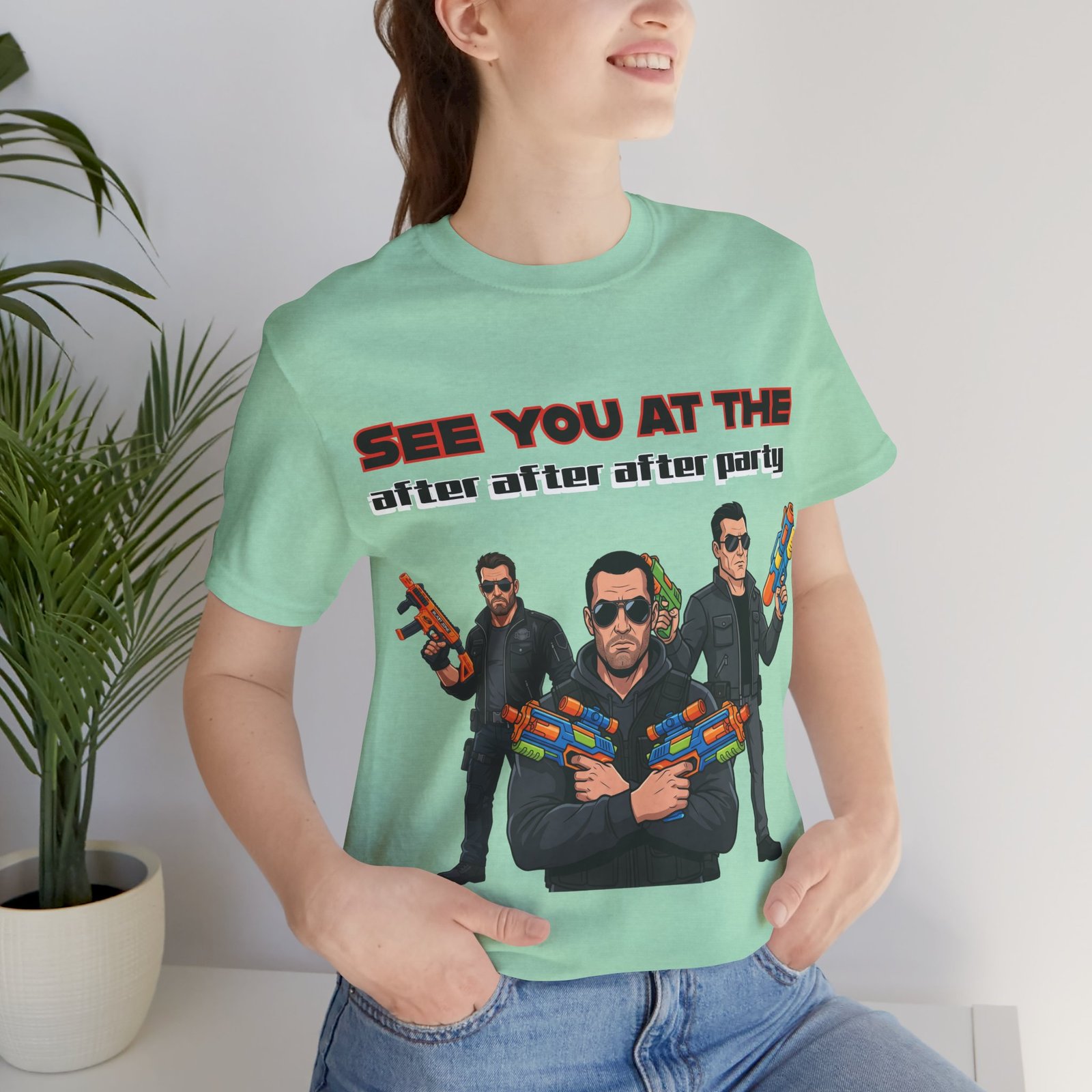 Light green t-shirt featuring three characters in sunglasses with colorful toy blasters and the text SEE YOU AT THE after party