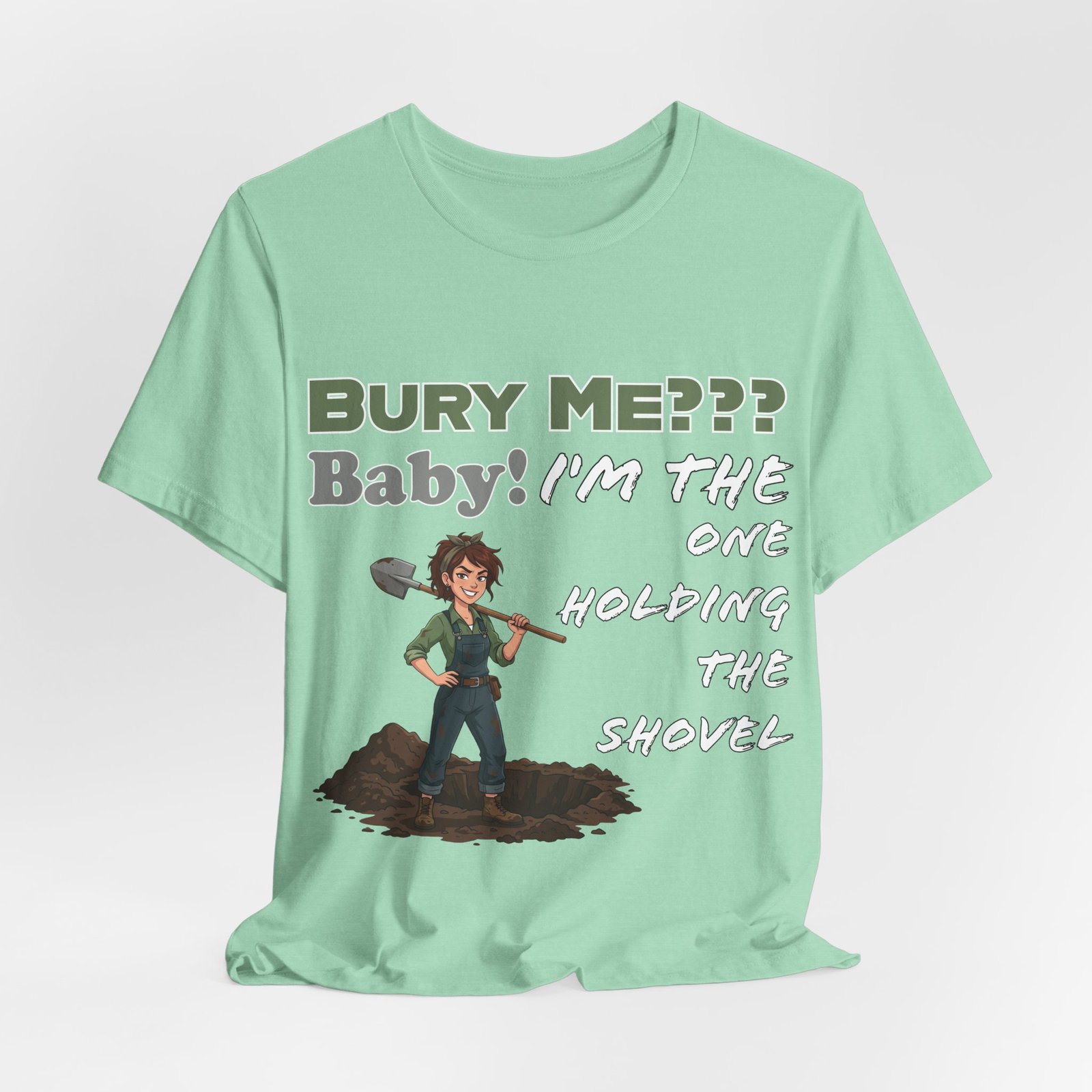 Mint green t-shirt featuring an illustrated character with a shovel and the text "Bury Me??? Baby! I'm the One Holding the Shovel"
