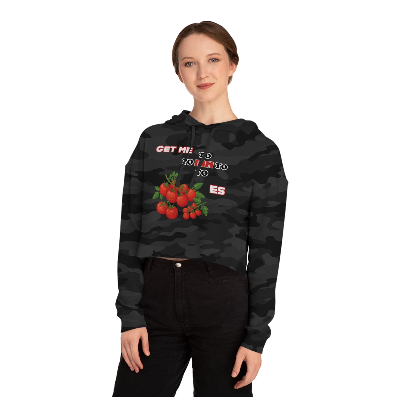 Model wearing a black camouflage Cropped Hoodie Get Me to Tomatoes with a red tomato cluster graphic.