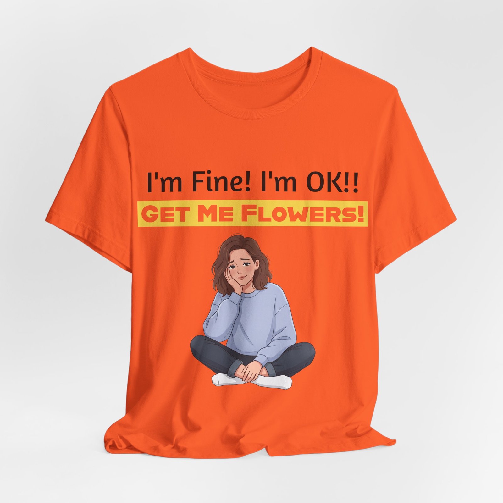 Orange t-shirt featuring a cartoon woman and the funny text "I'm Fine! I'm OK!! GET ME FLOWERS!"