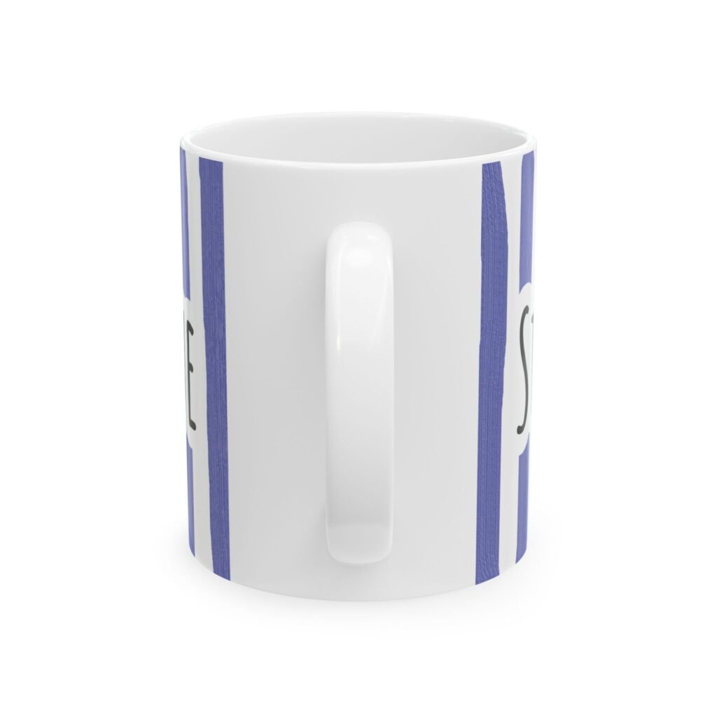 Periwinkle striped ceramic mug featuring hand-lettered 'Stay Under Blue' text and vertical brushstroke stripes.