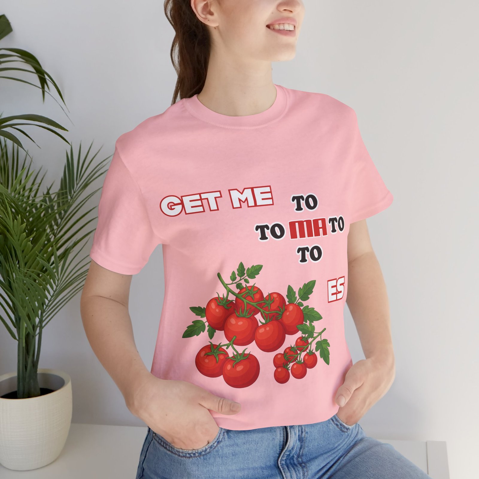 Pink crew neck t-shirt featuring a vintage tomato illustration and the text 'GET ME TO MA TO TOES'.