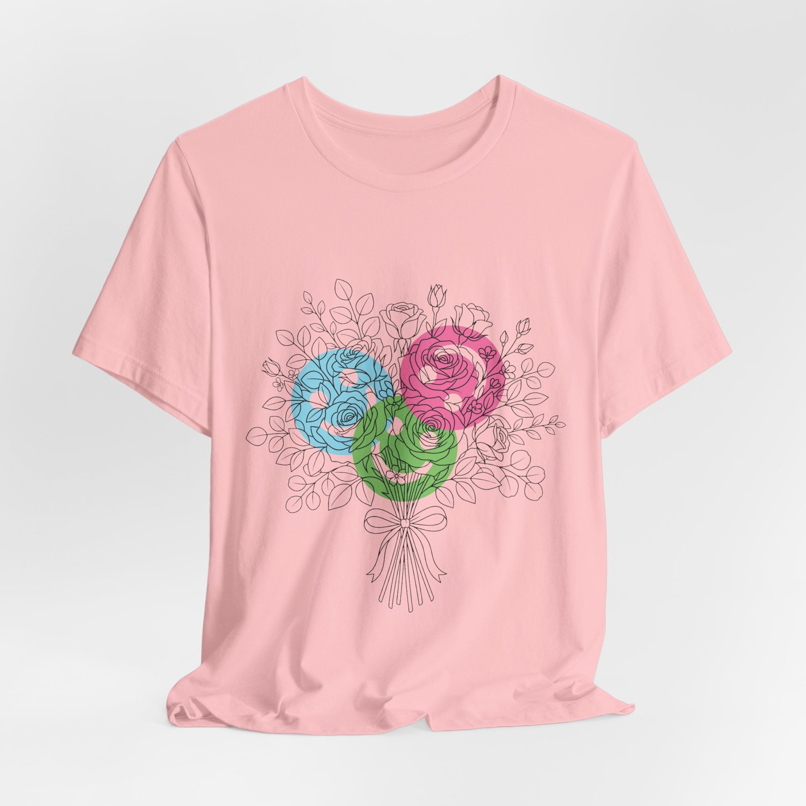 Pink T-shirt featuring a hand-drawn bouquet of teal, magenta, and lime floral yarn blooms.
