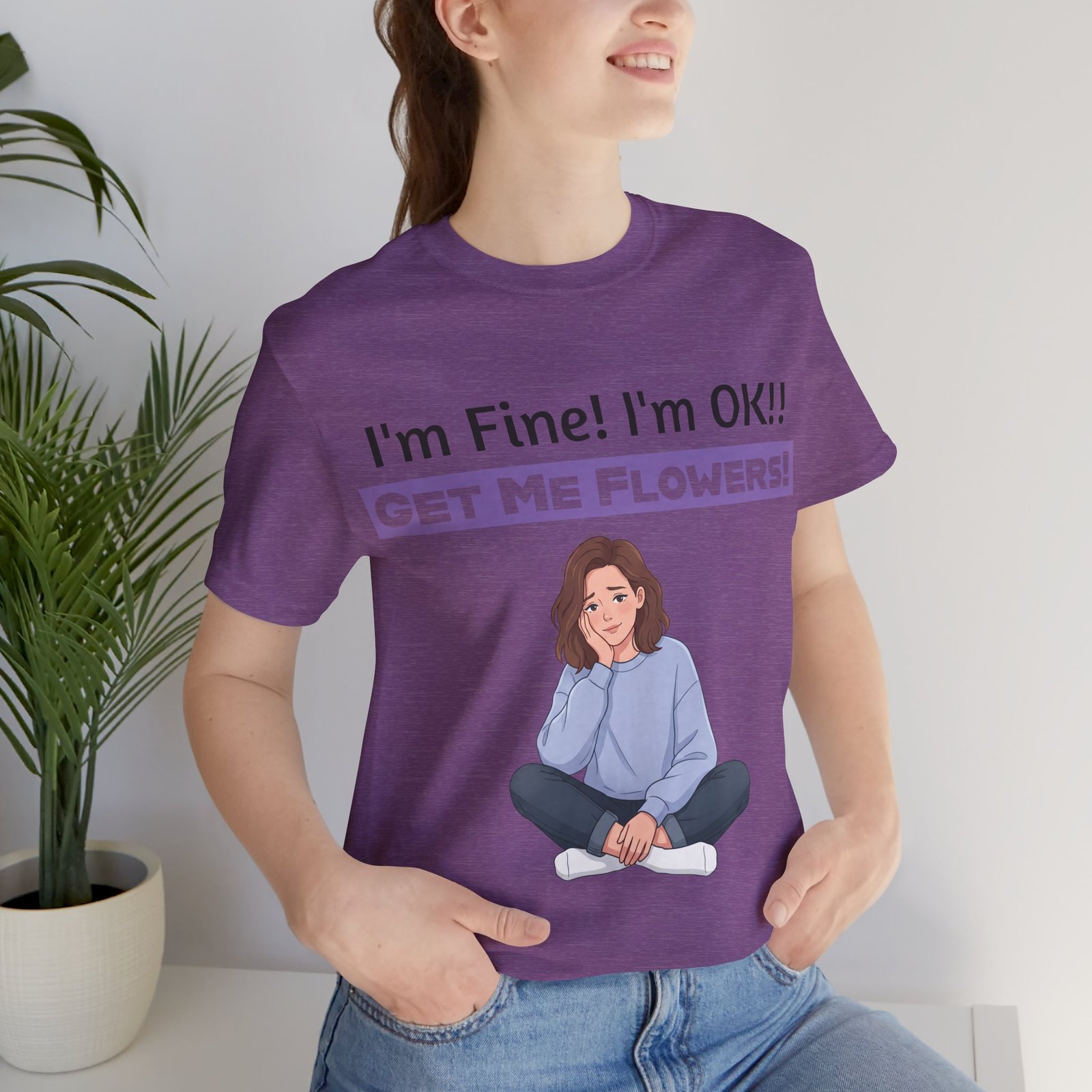 Purple funny t-shirt featuring an illustration of a girl and text reading I'm Fine! I'm OK!! Get Me Flowers!