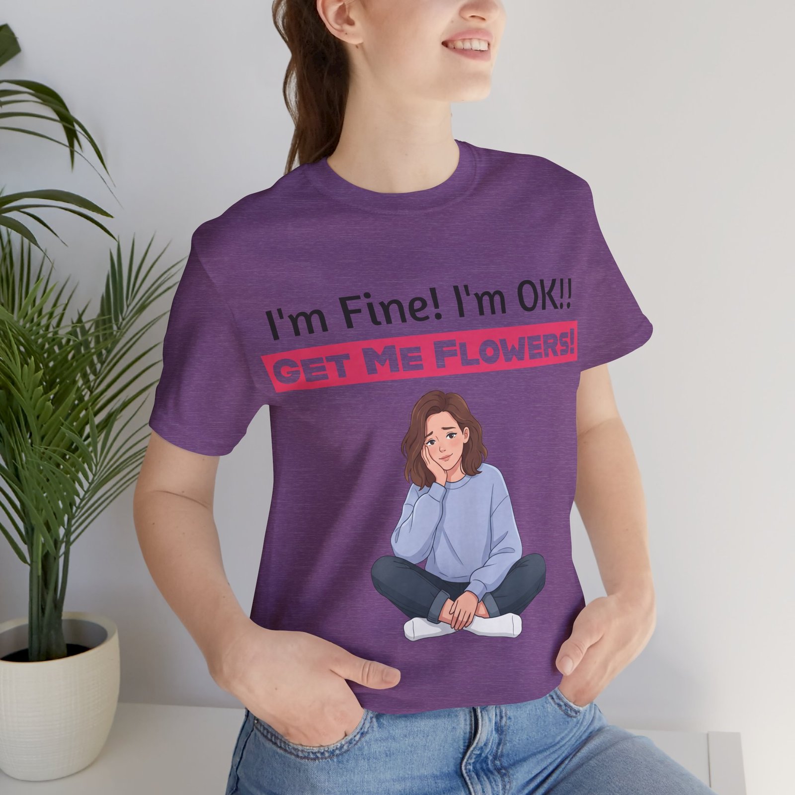 Purple funny t-shirt with "I'm Fine! I'm OK!! GET ME FLOWERS!" text and a cartoon of a woman sitting cross-legged.