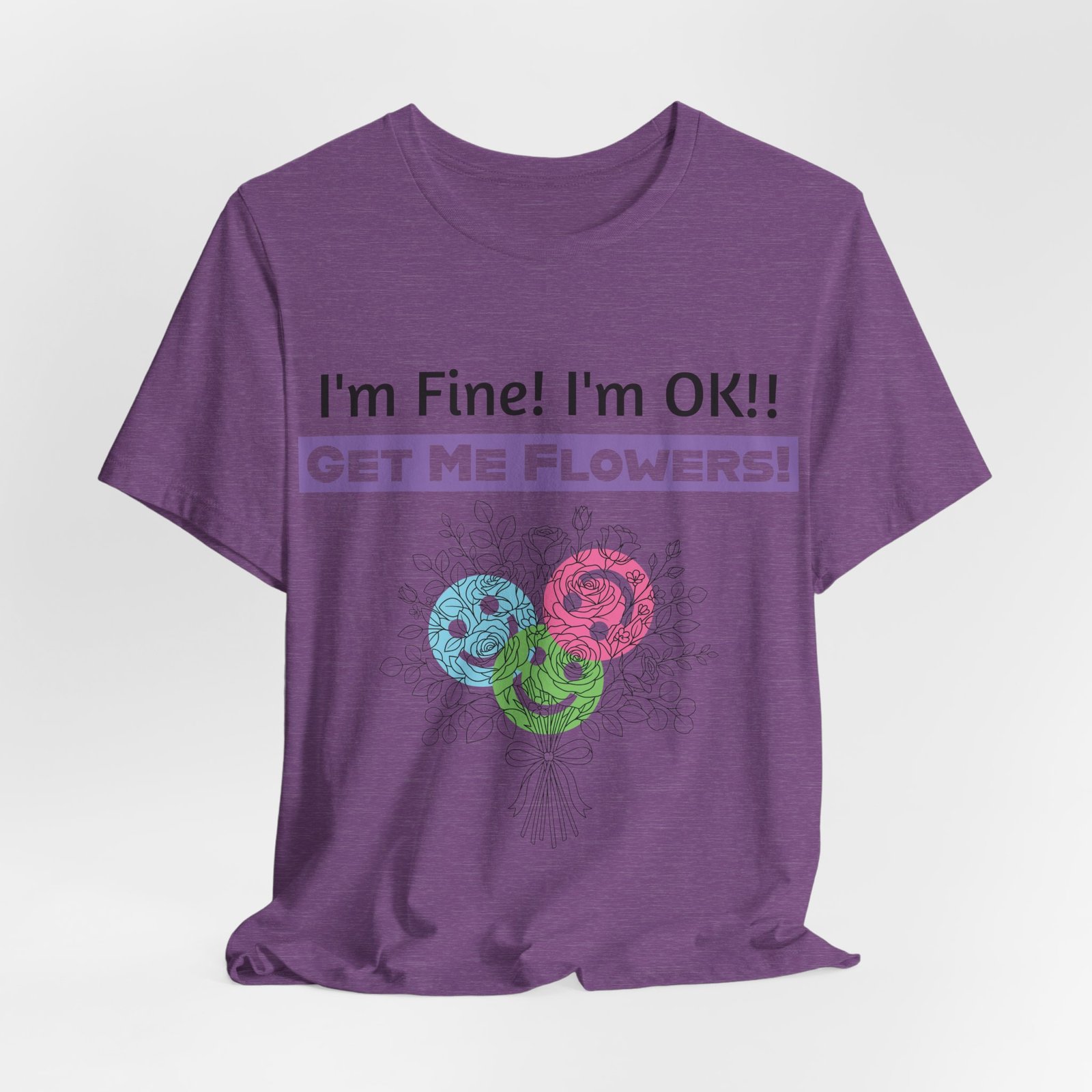Purple graphic t-shirt featuring the sarcastic text "I'm Fine! I'm OK!! GET ME FLOWERS!" and a colorful floral bouquet.