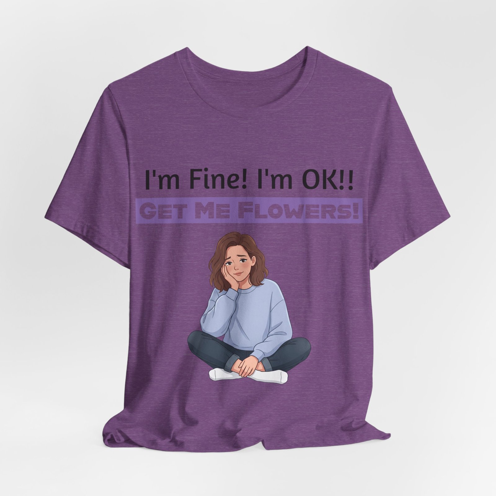 Purple t-shirt featuring a cartoon girl sitting with her chin in her hand under the text I'm Fine! I'm OK!! Get Me Flowers!