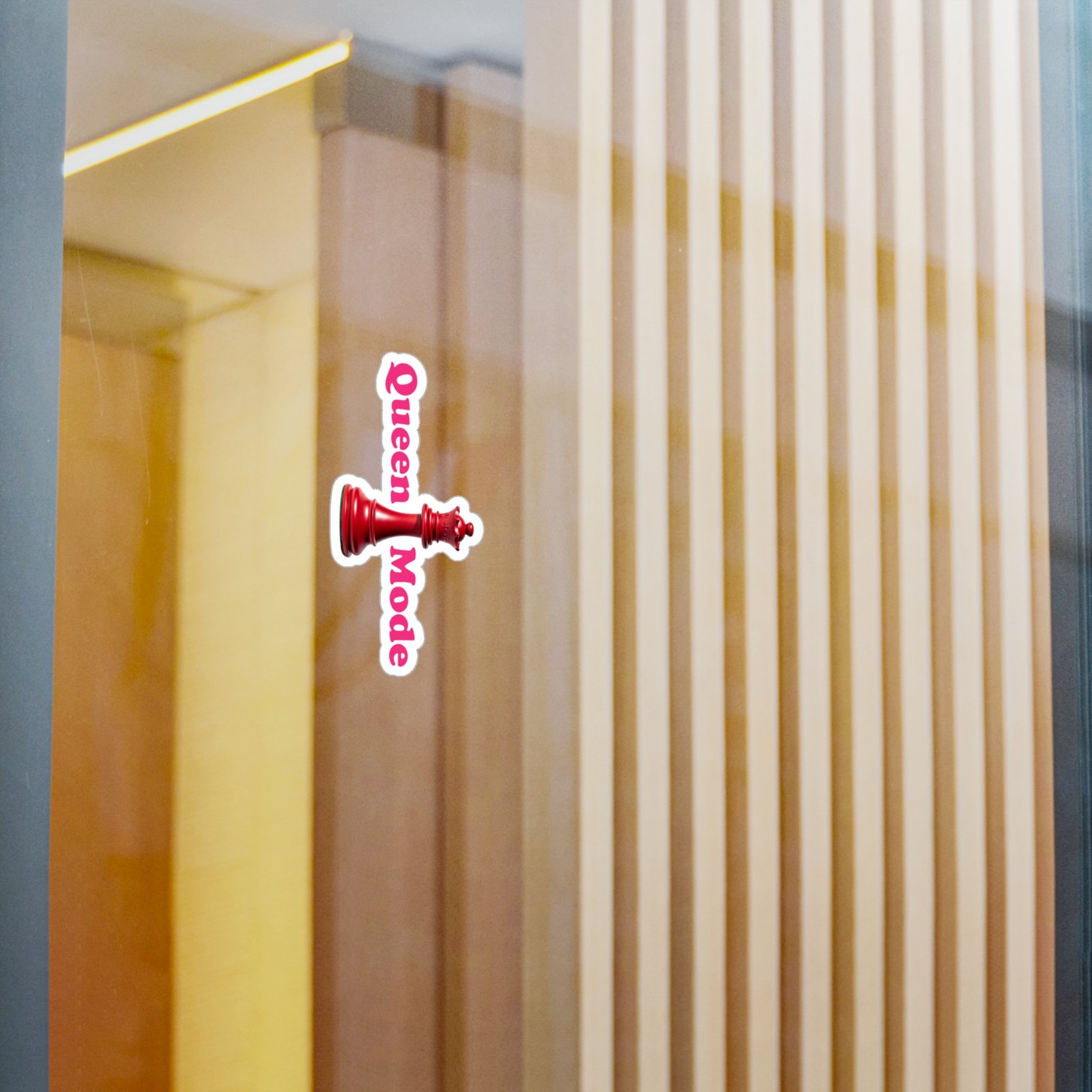 Queen Mode Red Chess Queen Sticker with pink lettering on a smooth reflective surface.