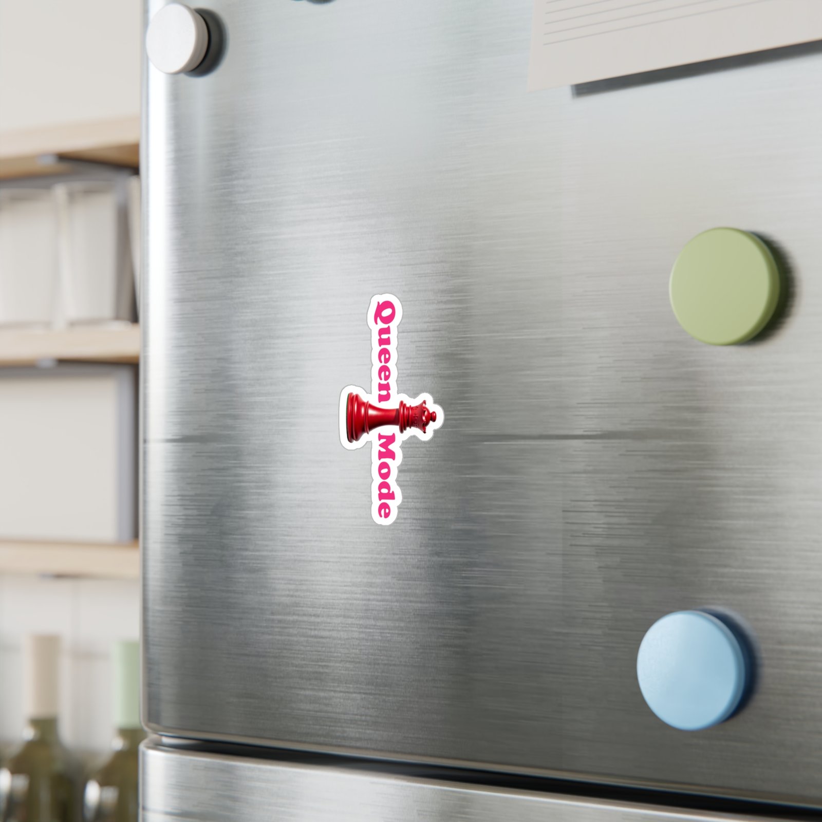 Queen Mode red chess queen sticker with pink lettering on a stainless steel refrigerator