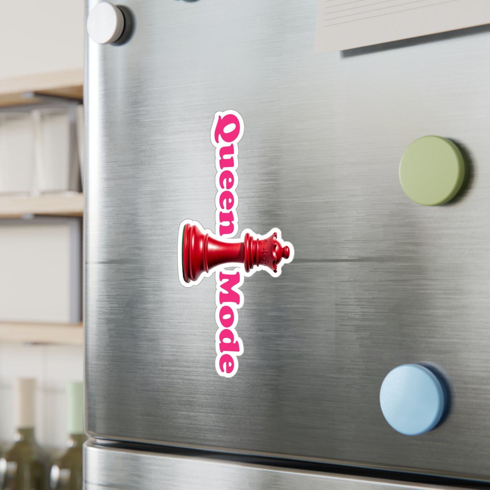 Queen Mode red chess queen sticker with pink vertical text on a stainless steel refrigerator.