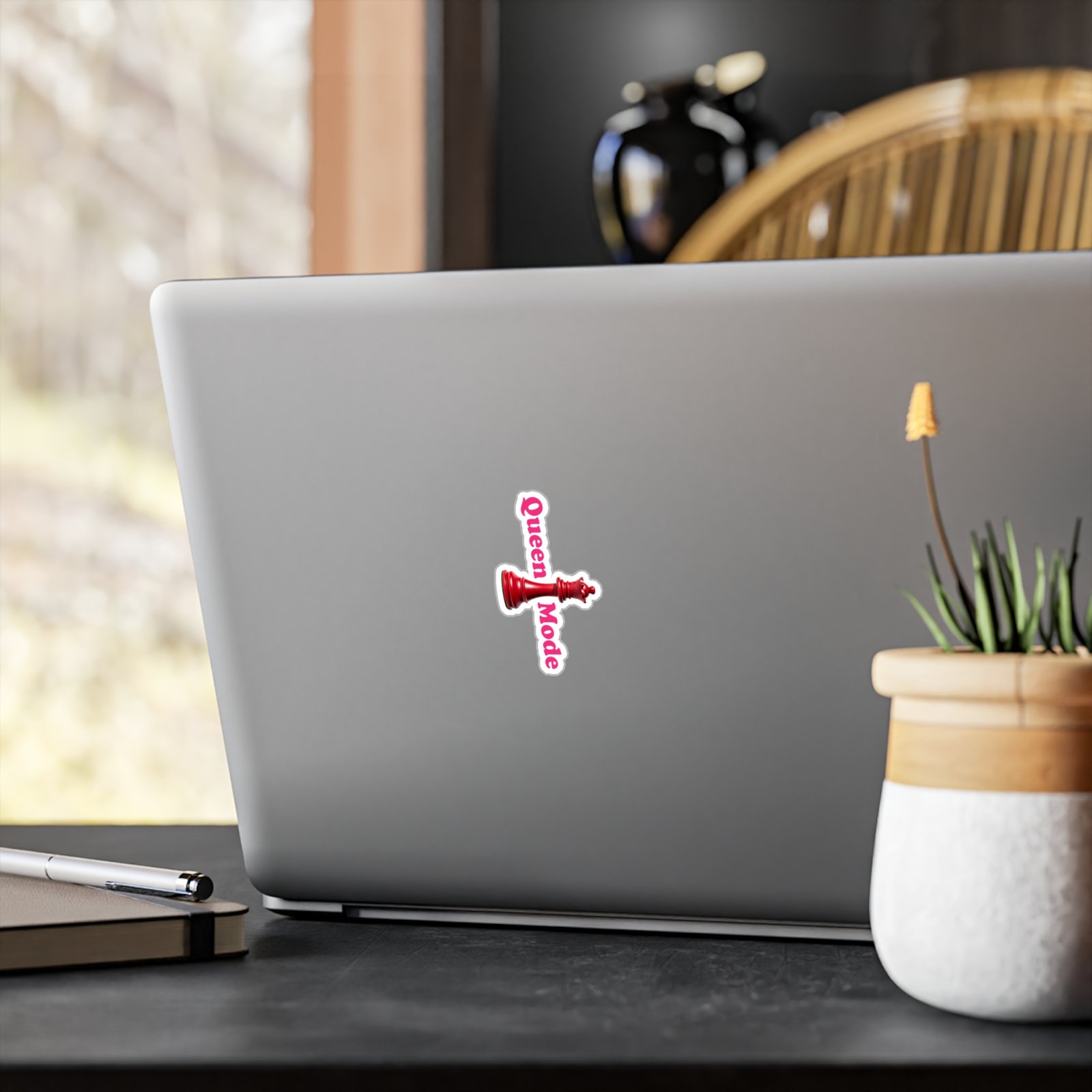 Queen Mode sticker with a red chess queen piece and pink text applied to a silver laptop.