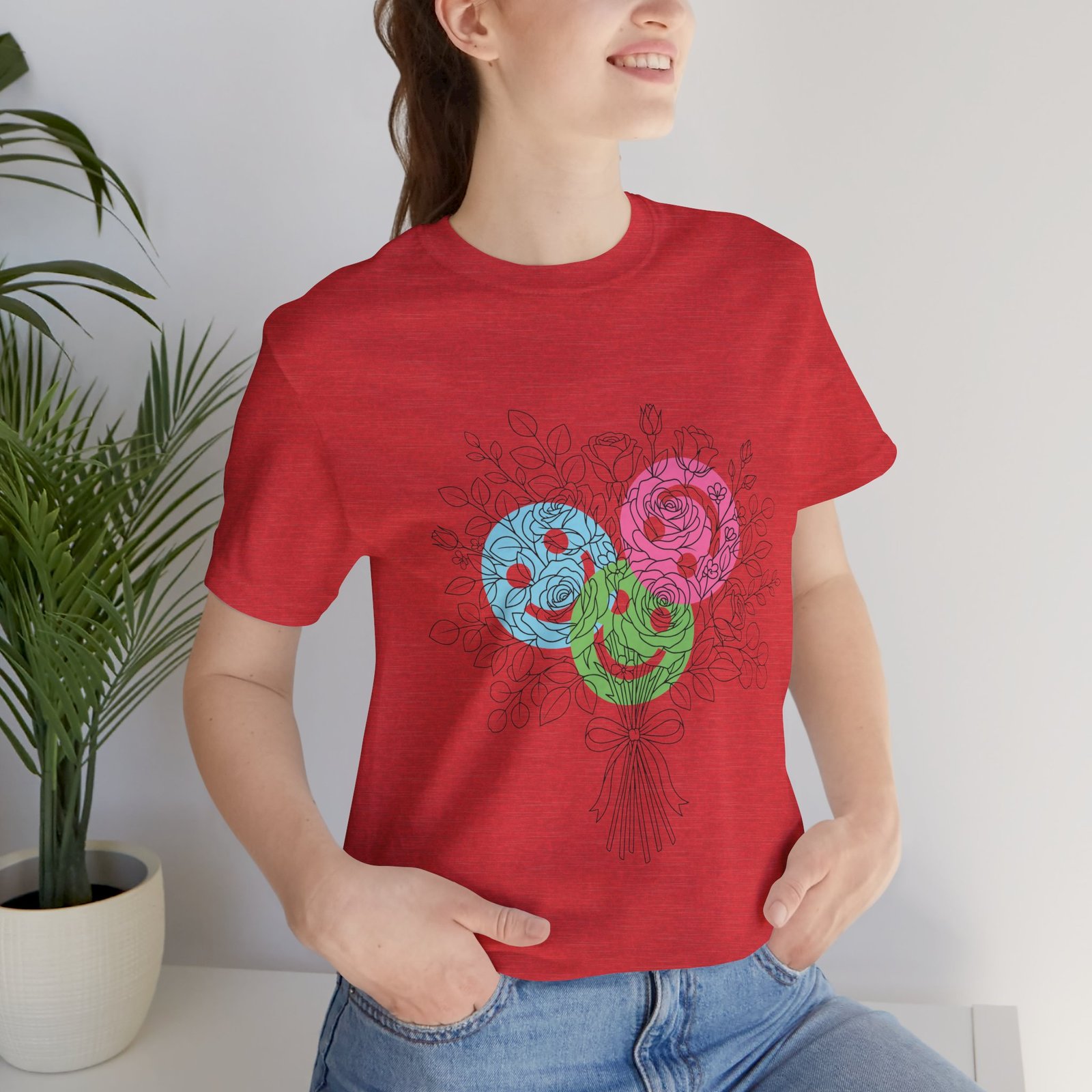 Red T-shirt featuring a hand-drawn bouquet of teal, magenta, and lime spiral floral blooms.