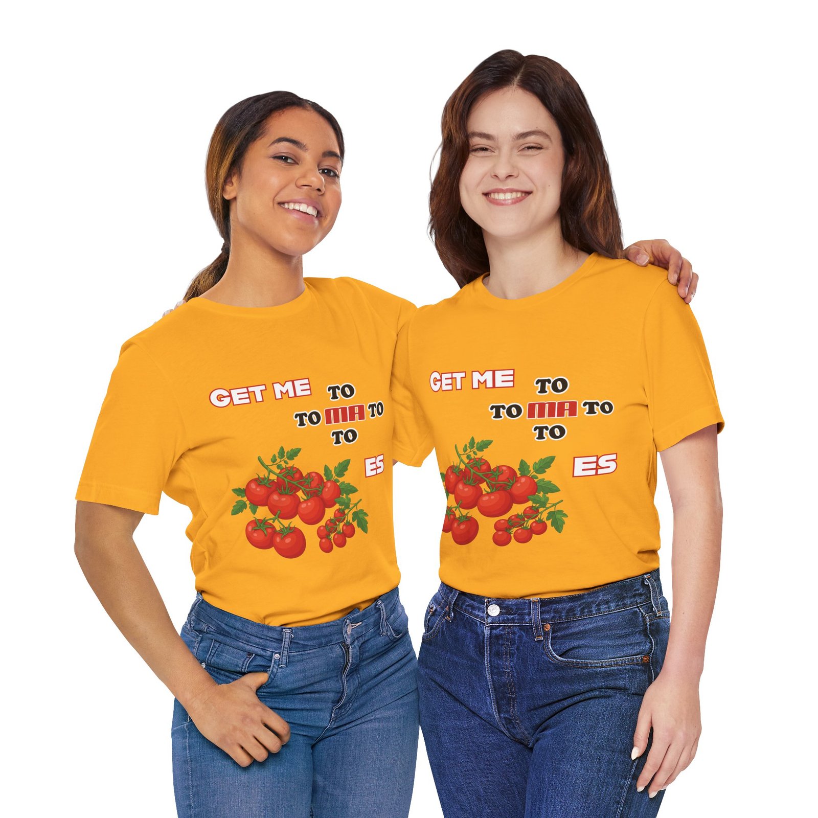 Two smiling women wearing yellow Get Me To Ma To Toes T-shirts featuring vintage tomato illustrations.