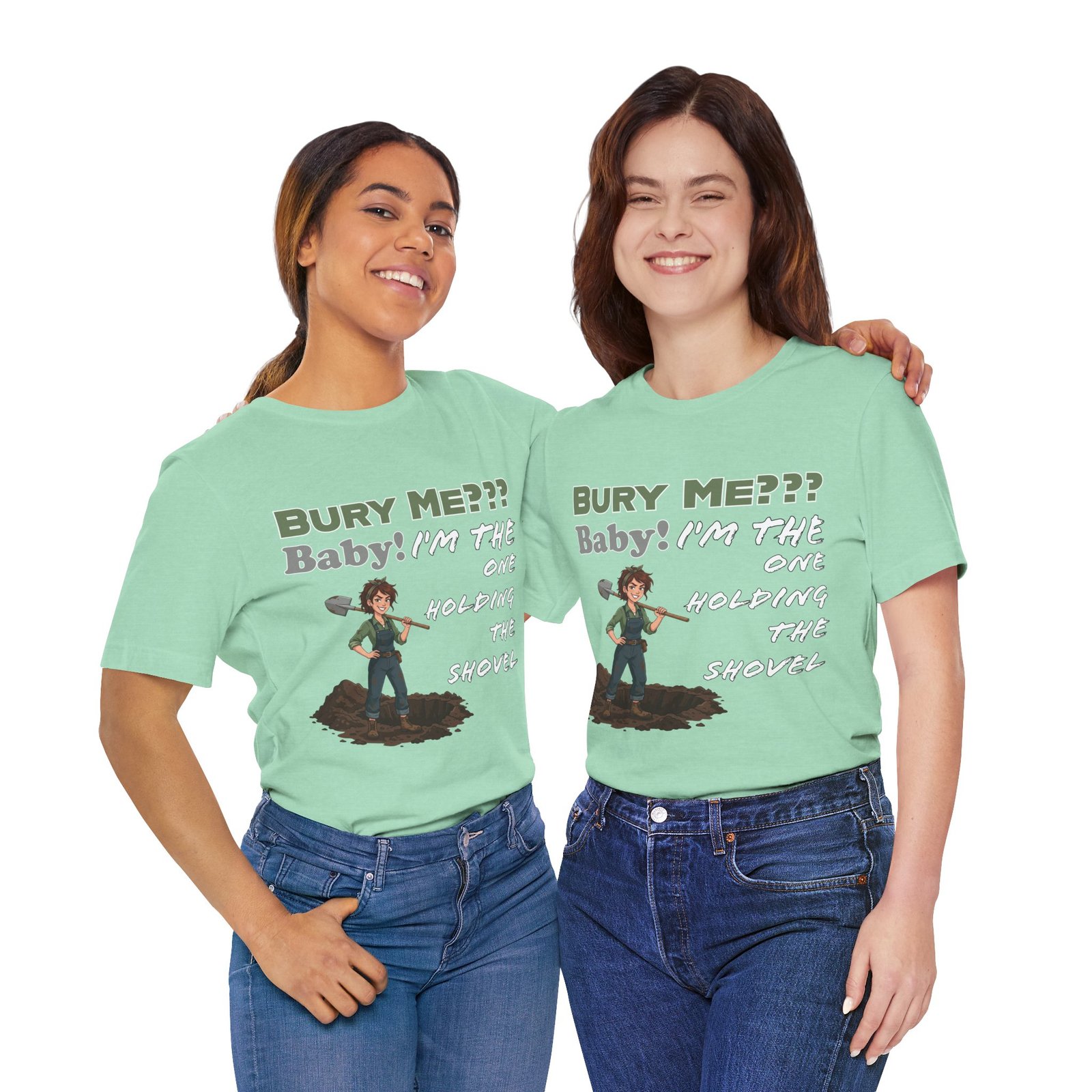 Two women smiling and wearing mint green "Bury Me??? Baby! I'm the One Holding the Shovel" t-shirts with dark humor graphics.