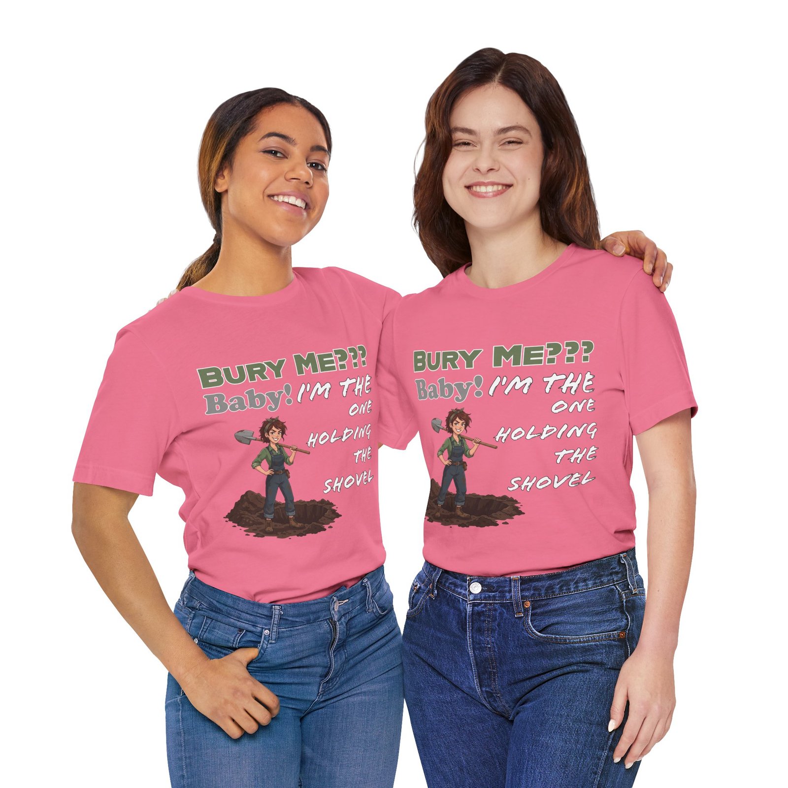 Two women smiling and wearing pink "Bury Me??? Baby! I'm the One Holding the Shovel" T-shirts with dark humor graphics.