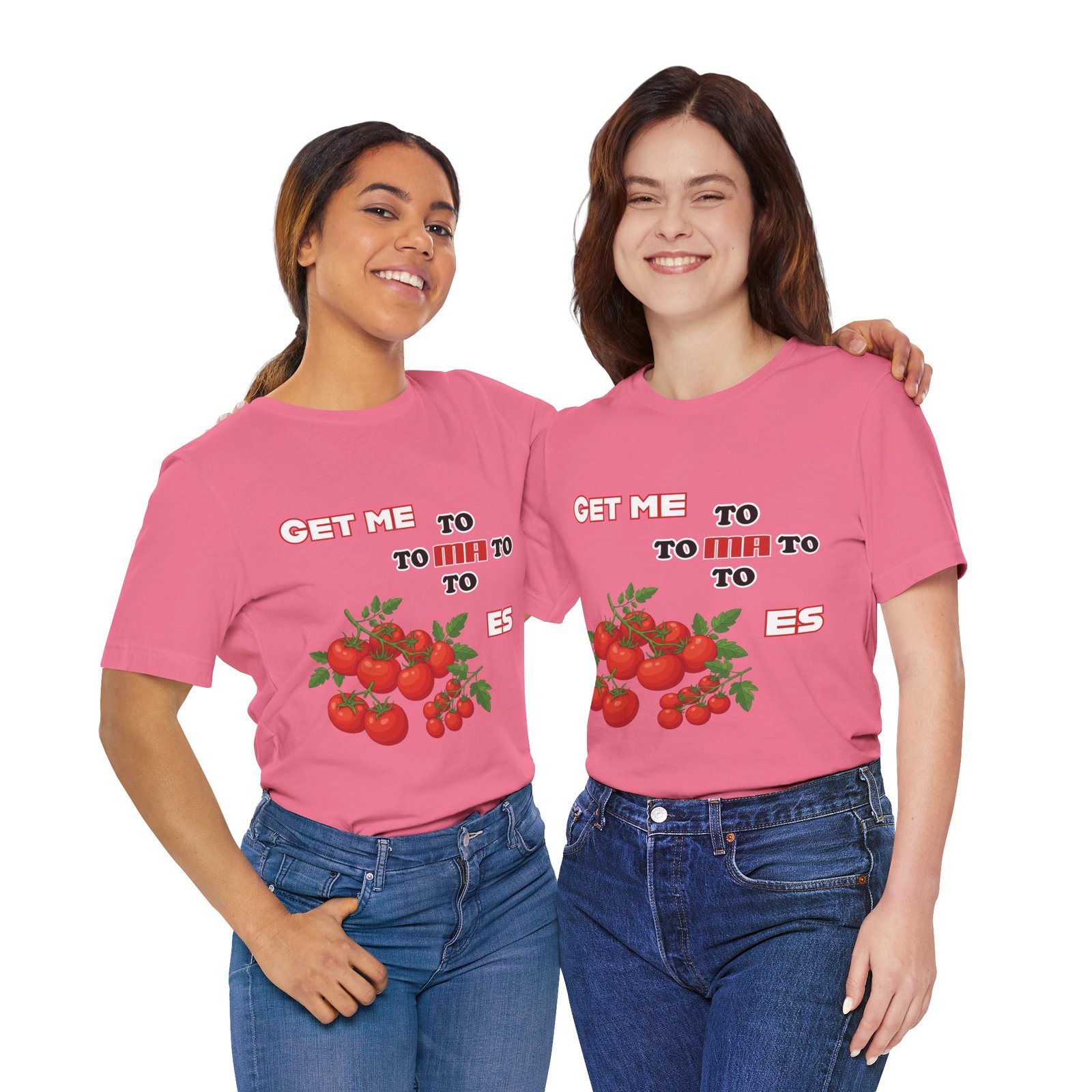 Two women smiling while wearing matching pink Get Me To Ma To Toes t-shirts featuring vintage tomato illustrations.