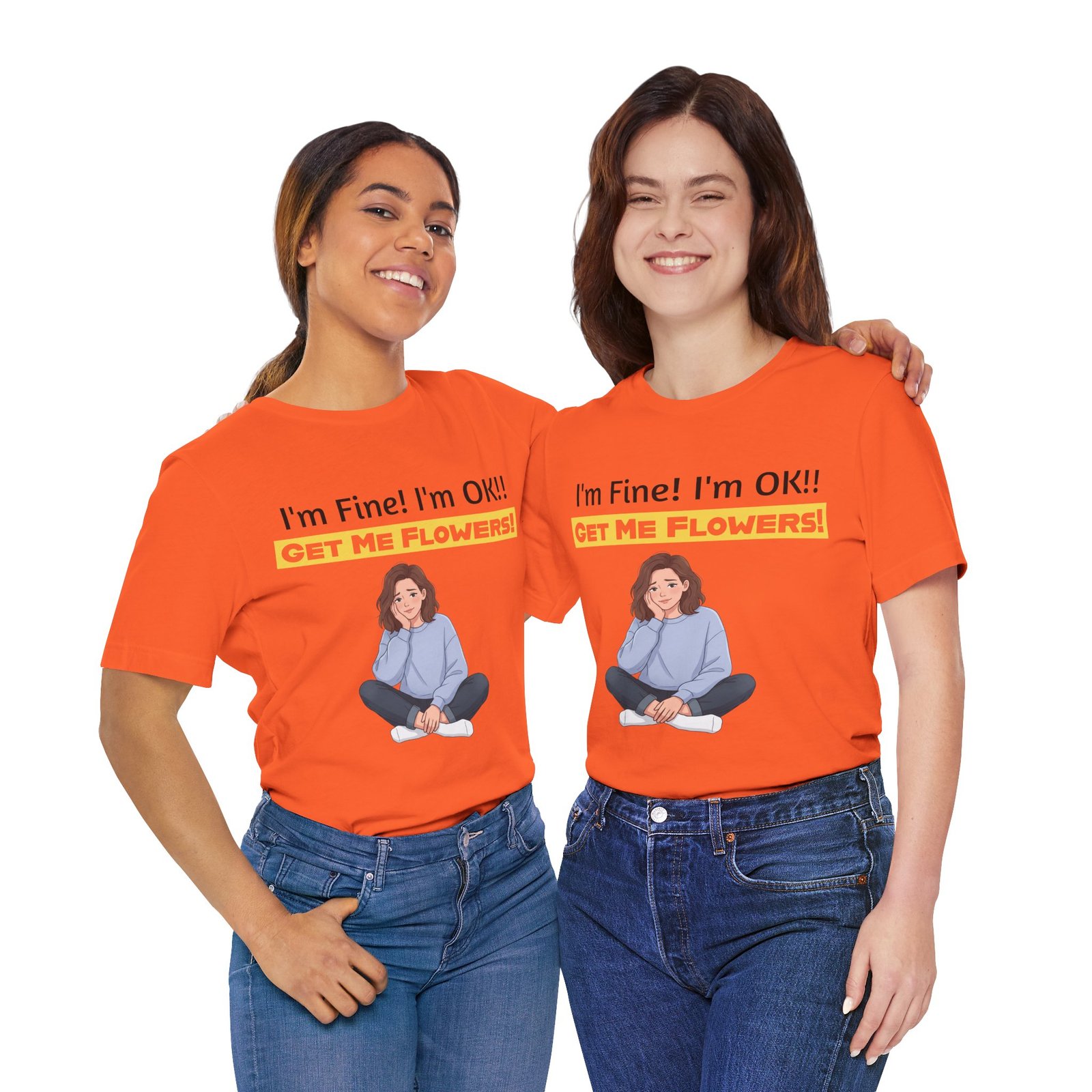 Two women smiling while wearing orange funny T-shirts that say I'm Fine! I'm OK!! GET ME FLOWERS!