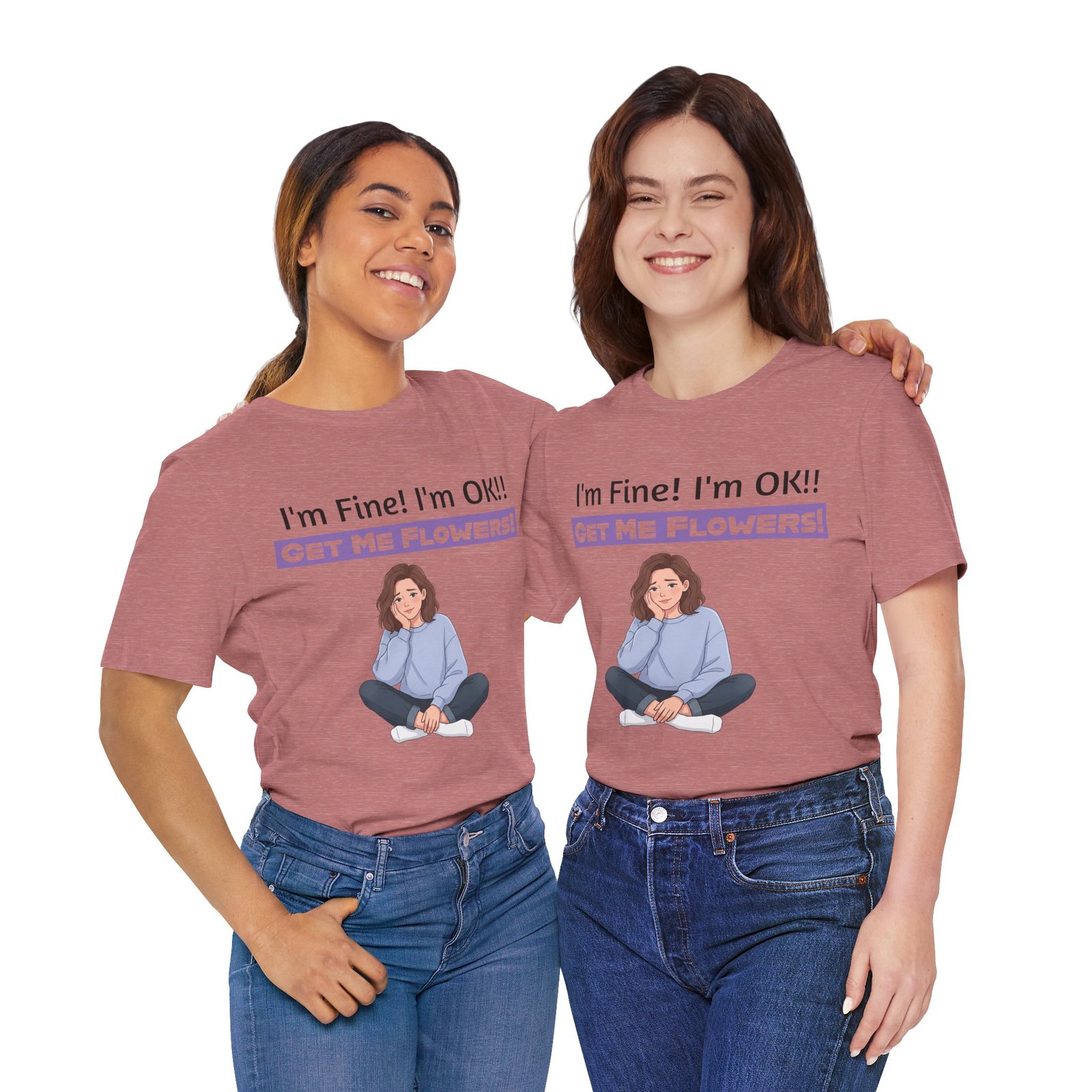 Two women smiling while wearing pink t-shirts featuring a girl illustration and the text I'm Fine! I'm OK!! GET ME FLOWERS!