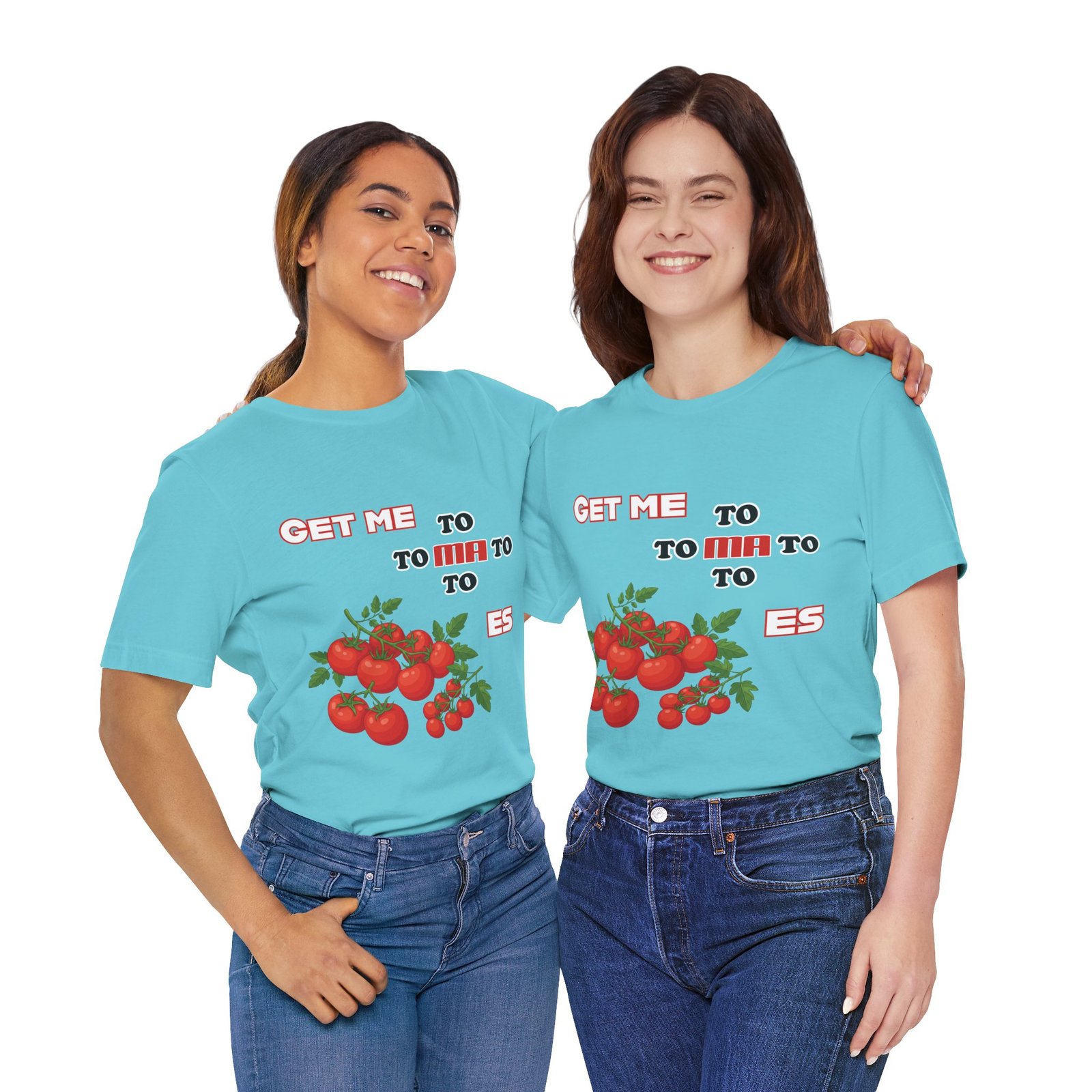 Two women smiling while wearing turquoise "Get Me To Ma To Toes" T-shirts featuring vintage tomato illustrations.