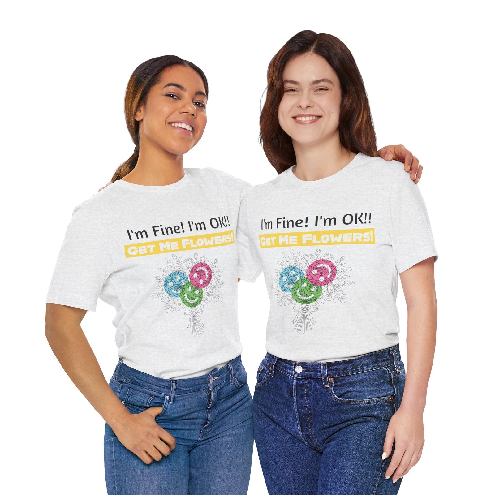 Two women smiling while wearing white crew-neck t-shirts featuring a colorful floral graphic and funny text.