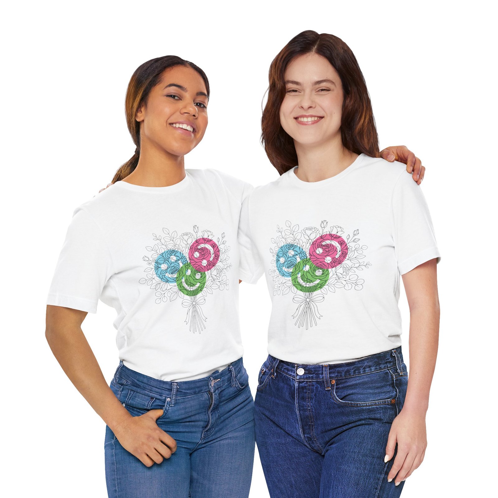 Two women smiling while wearing white t-shirts featuring a colorful floral yarn bouquet graphic.