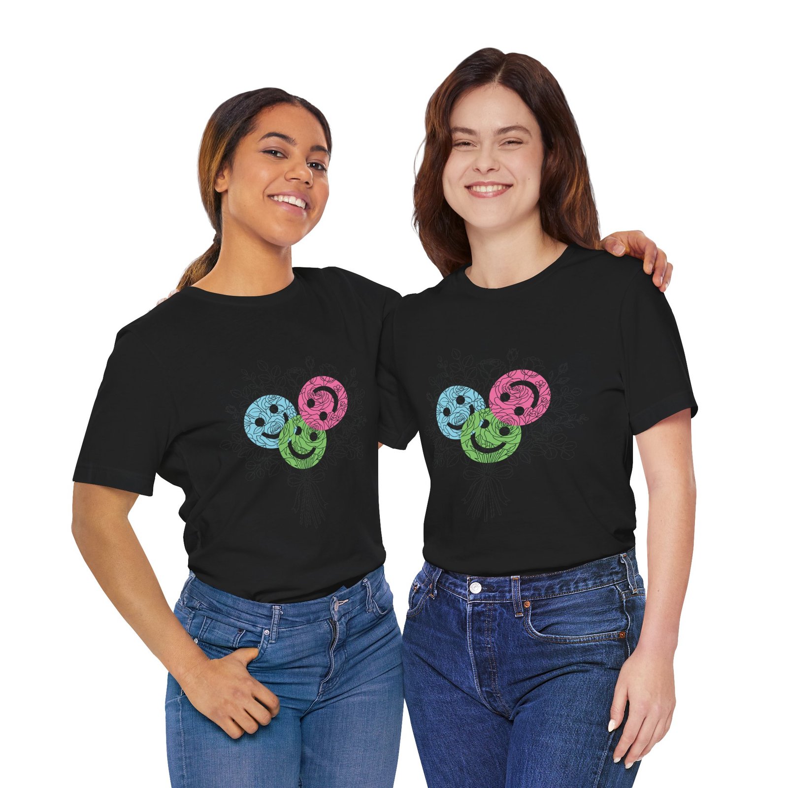 Two women wearing black crew neck t-shirts featuring three colorful teal, magenta, and lime spiral floral blooms.