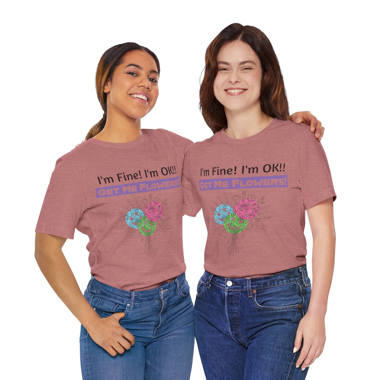 Two women wearing pink graphic t-shirts with the text "I'm Fine! I'm OK!! GET ME FLOWERS!" and a colorful floral design.