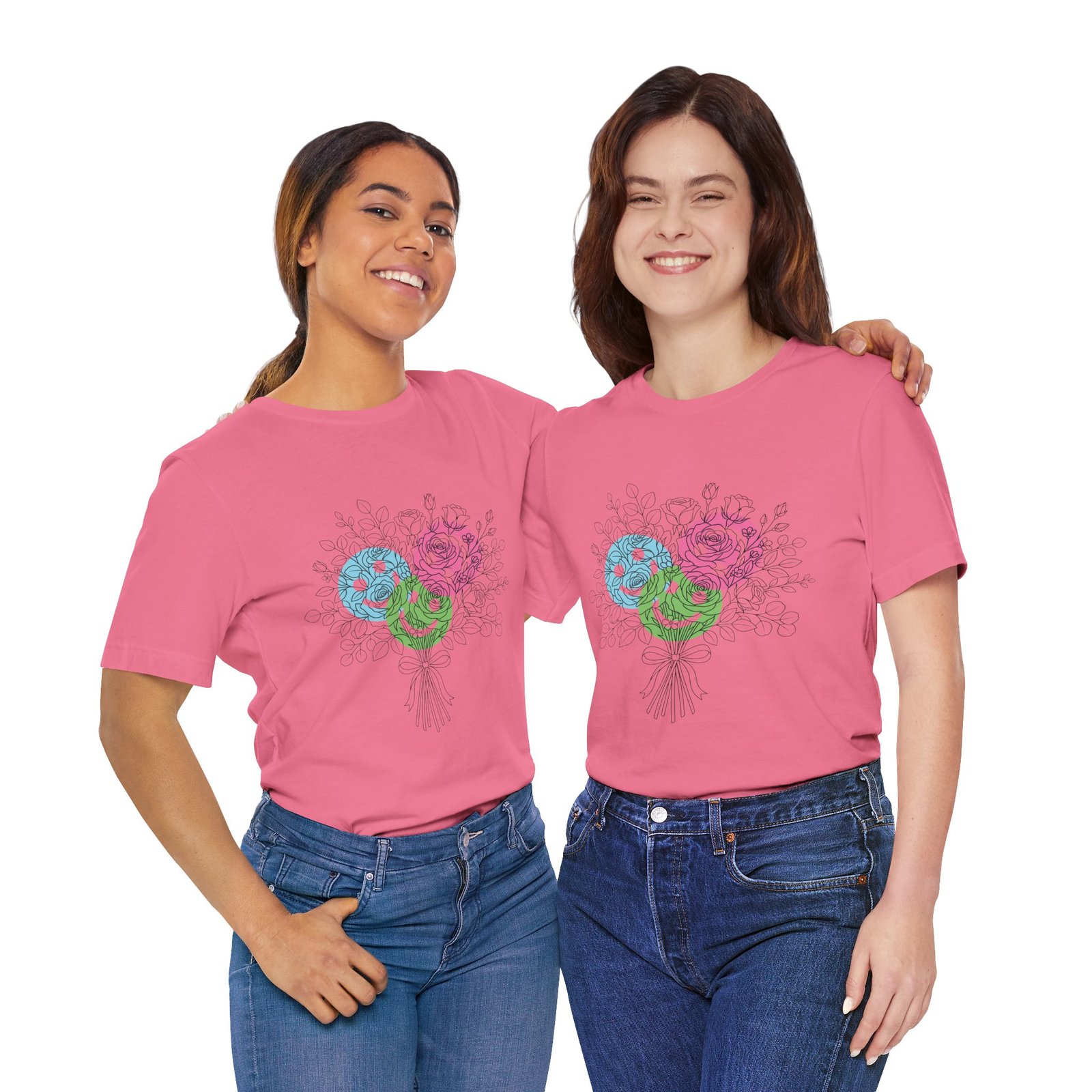 Two women wearing pink t-shirts featuring a colorful, hand-drawn floral yarn bouquet design.