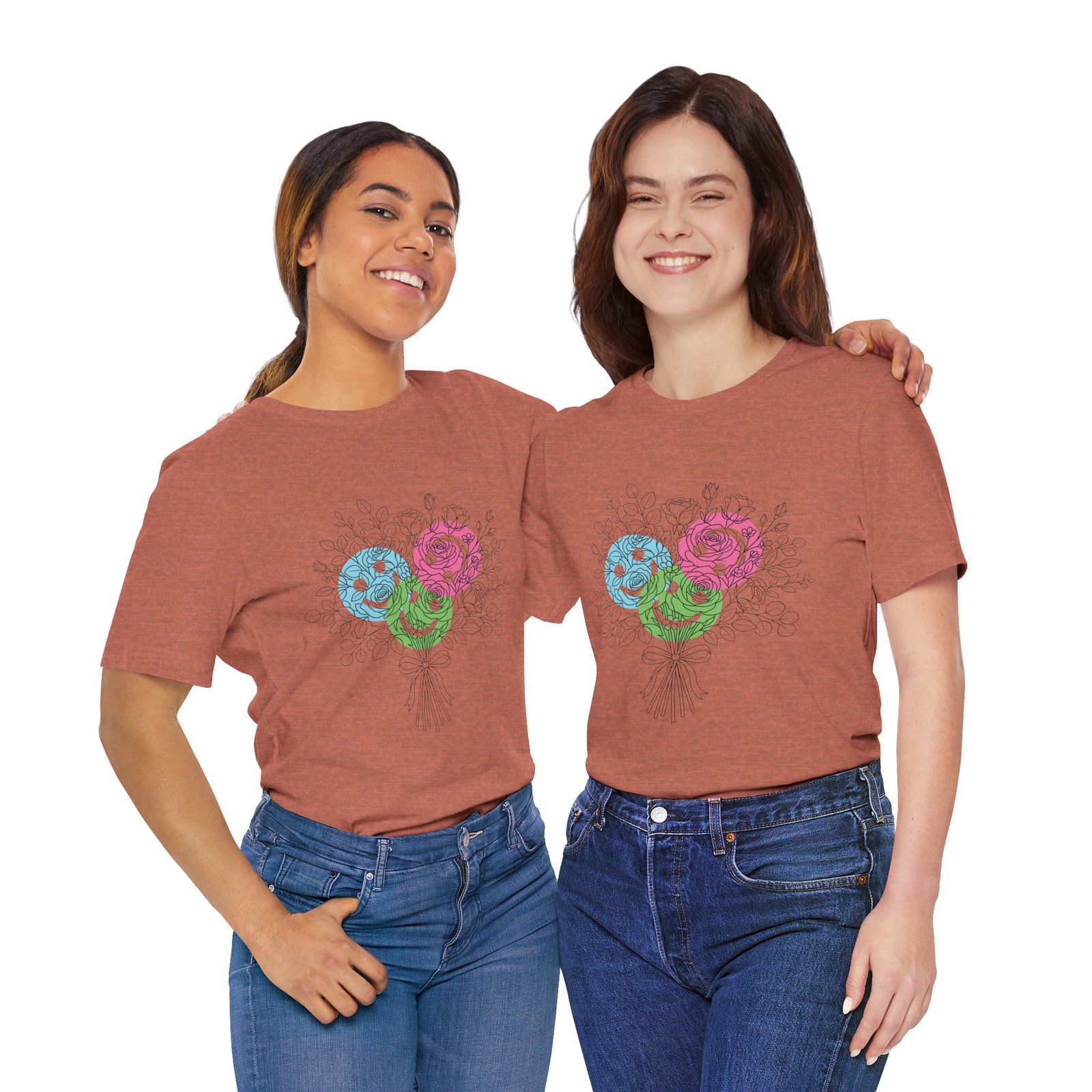 Two women wearing terracotta t-shirts featuring a colorful hand-drawn floral yarn bouquet design.