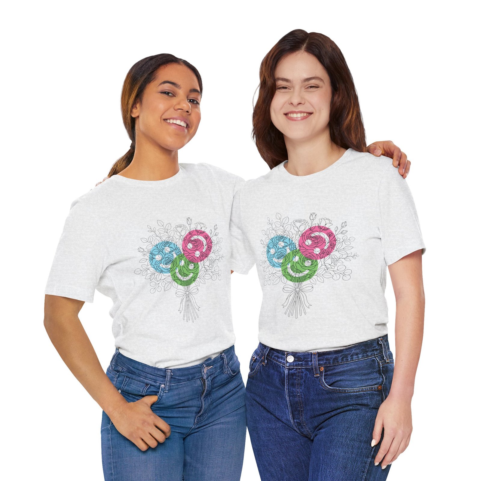 Two women wearing white t-shirts featuring a colorful sketch of a floral yarn bouquet in teal, magenta, and lime.