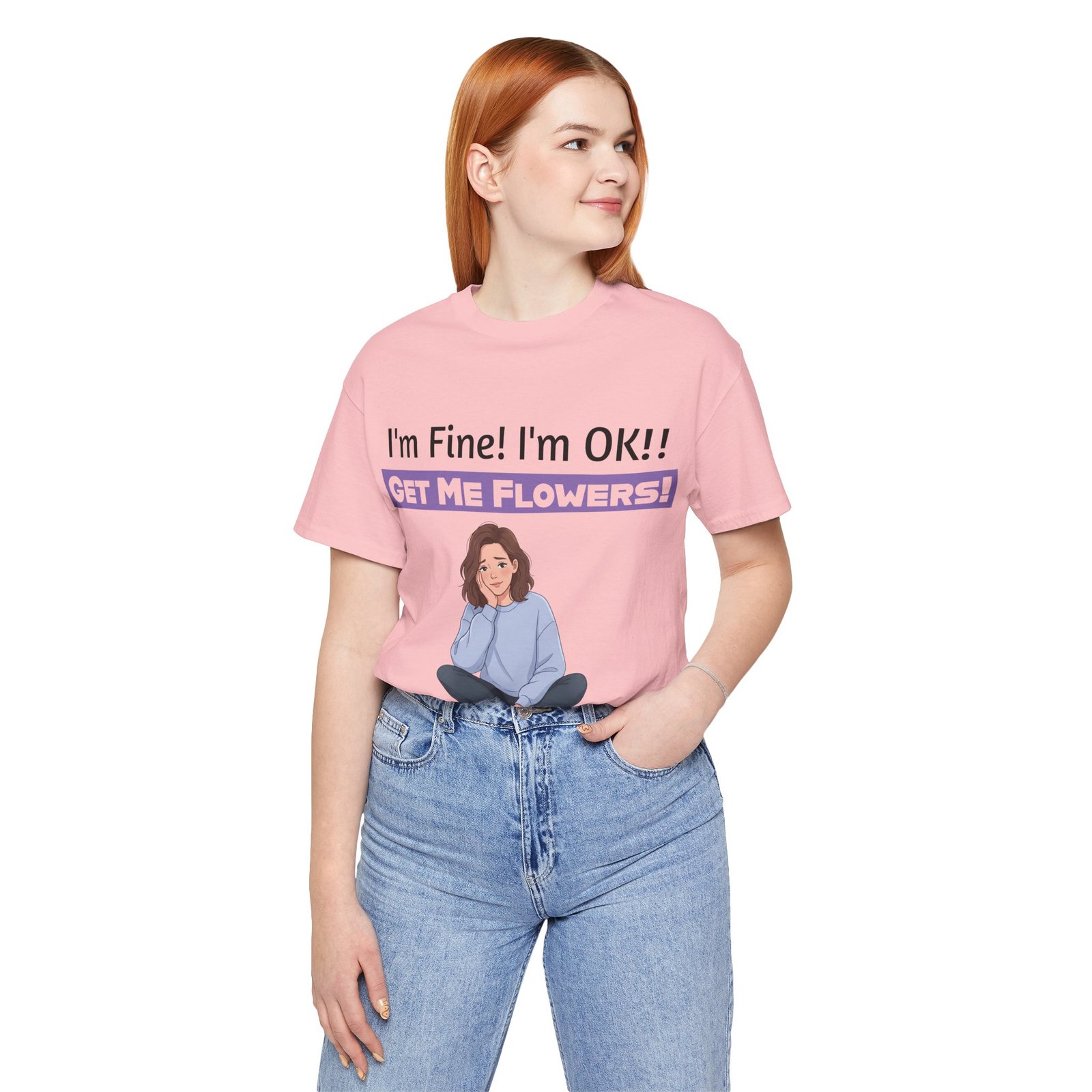 Woman in a pink T-shirt featuring a girl illustration and the text I'm Fine! I'm OK!! GET ME FLOWERS!
