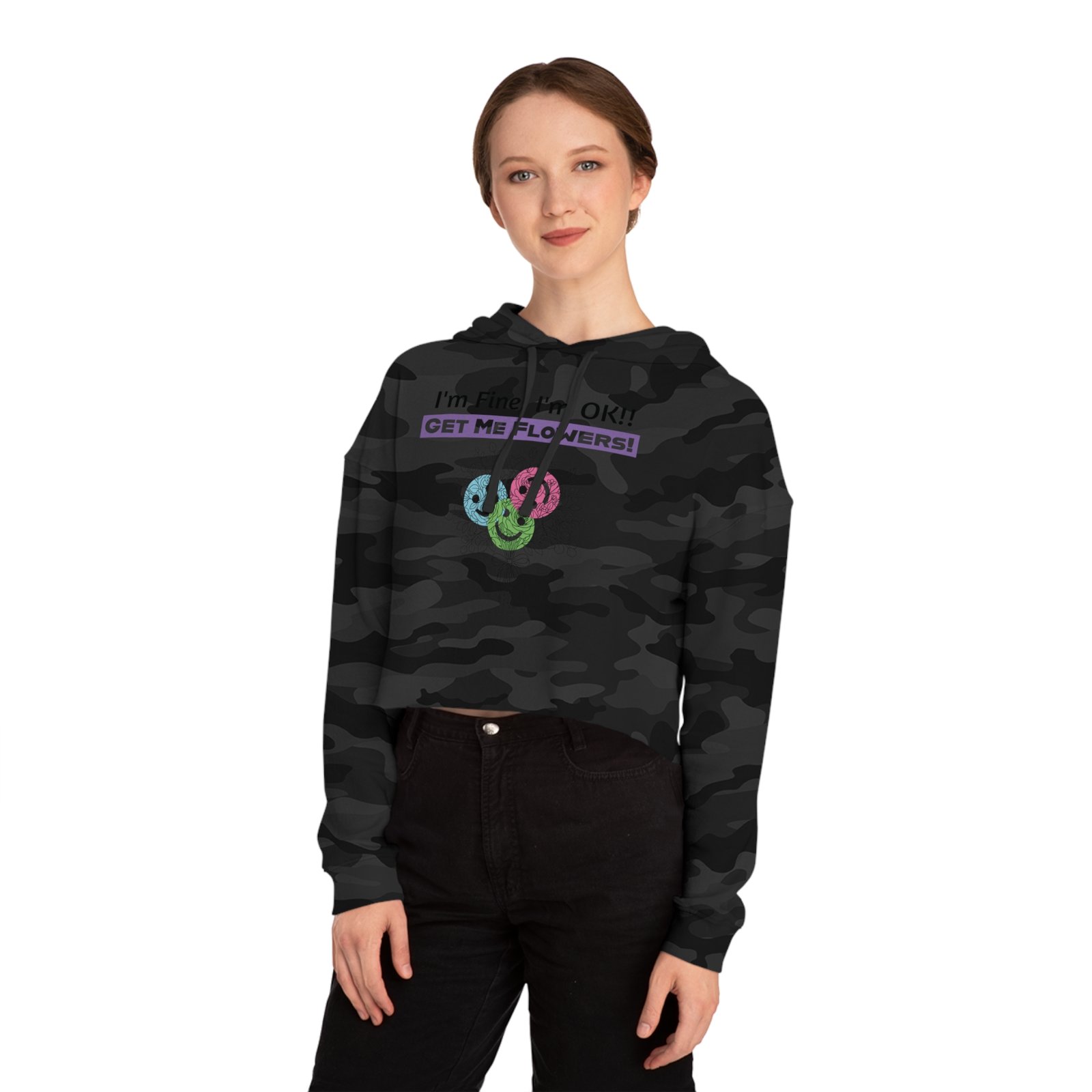 Woman wearing a black camouflage cropped hoodie with I'm Fine! I'm OK!! Get Me Flowers! floral design.