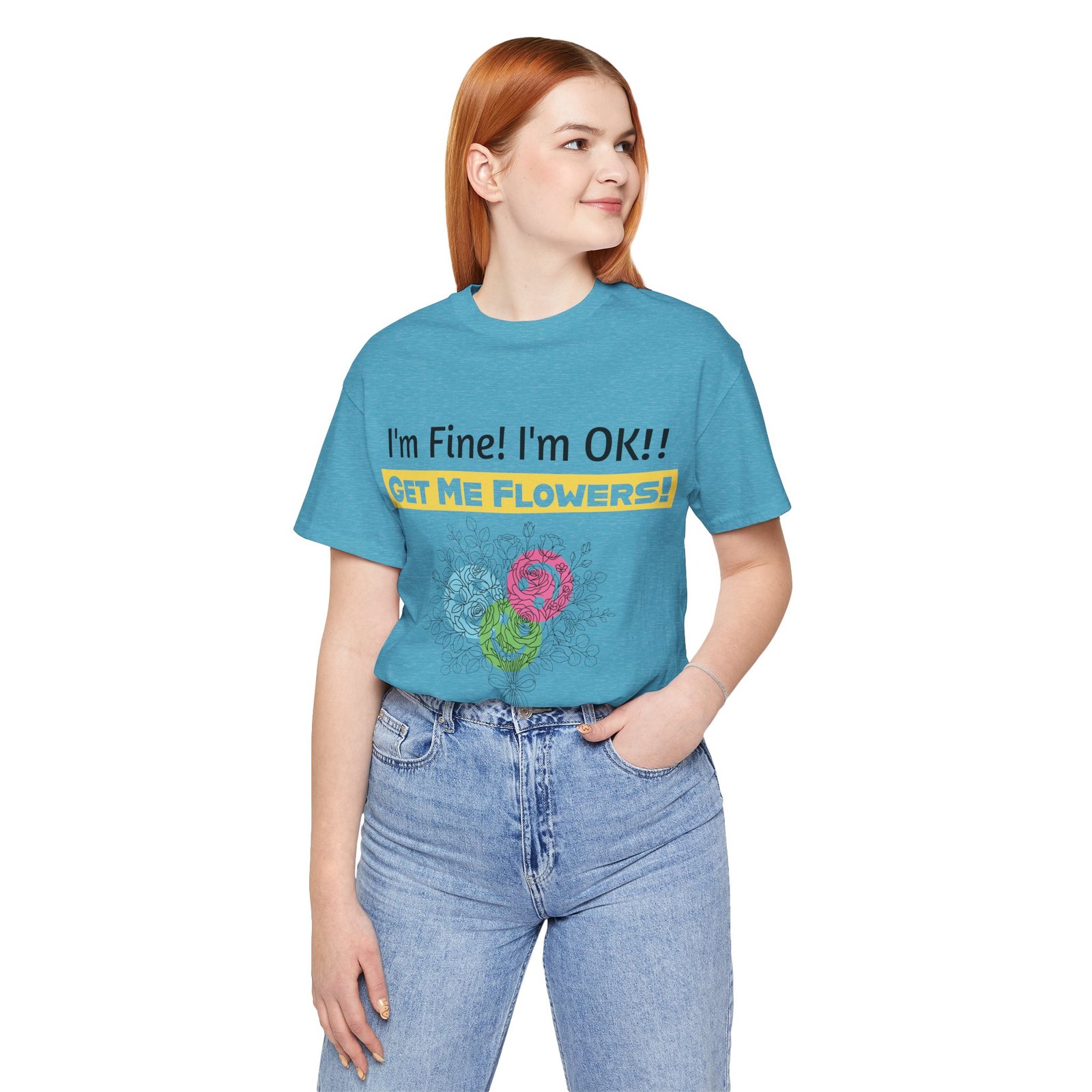 Woman wearing a blue crew-neck T-shirt with "I'm Fine! I'm OK!! GET ME FLOWERS!" text and abstract floral graphic.