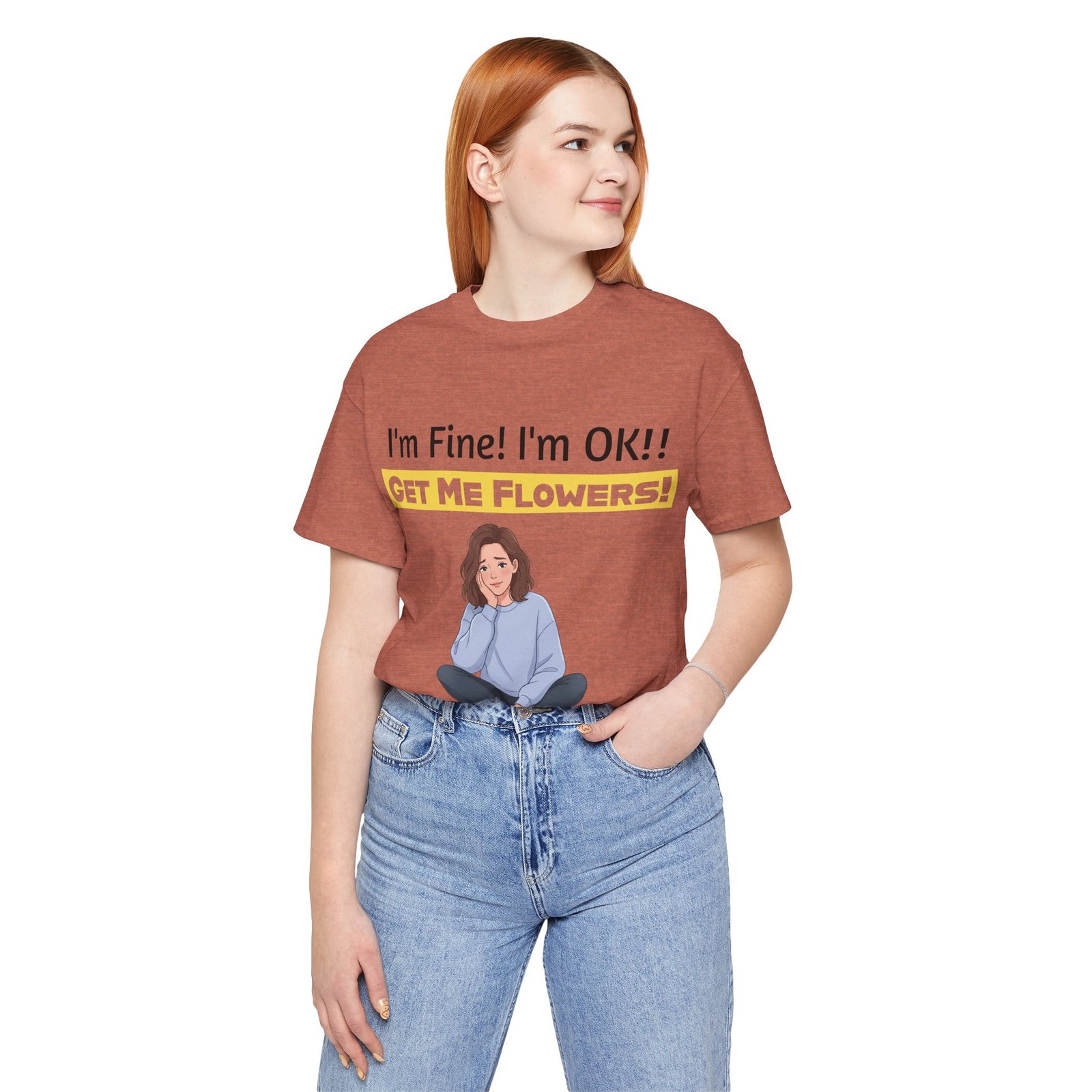 Woman wearing a brown t-shirt with 'I'm Fine! I'm OK!! GET ME FLOWERS!' text and a cartoon illustration.