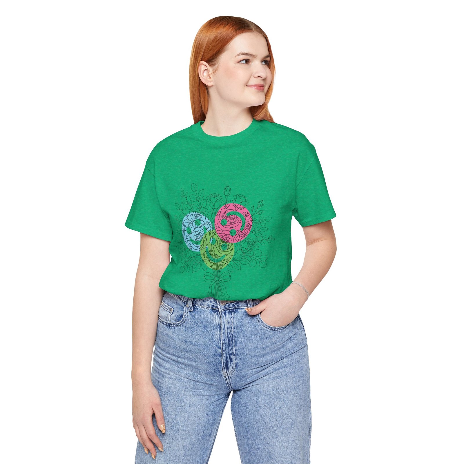 Woman wearing a green t-shirt with a colorful teal, magenta, and lime floral yarn bouquet graphic.