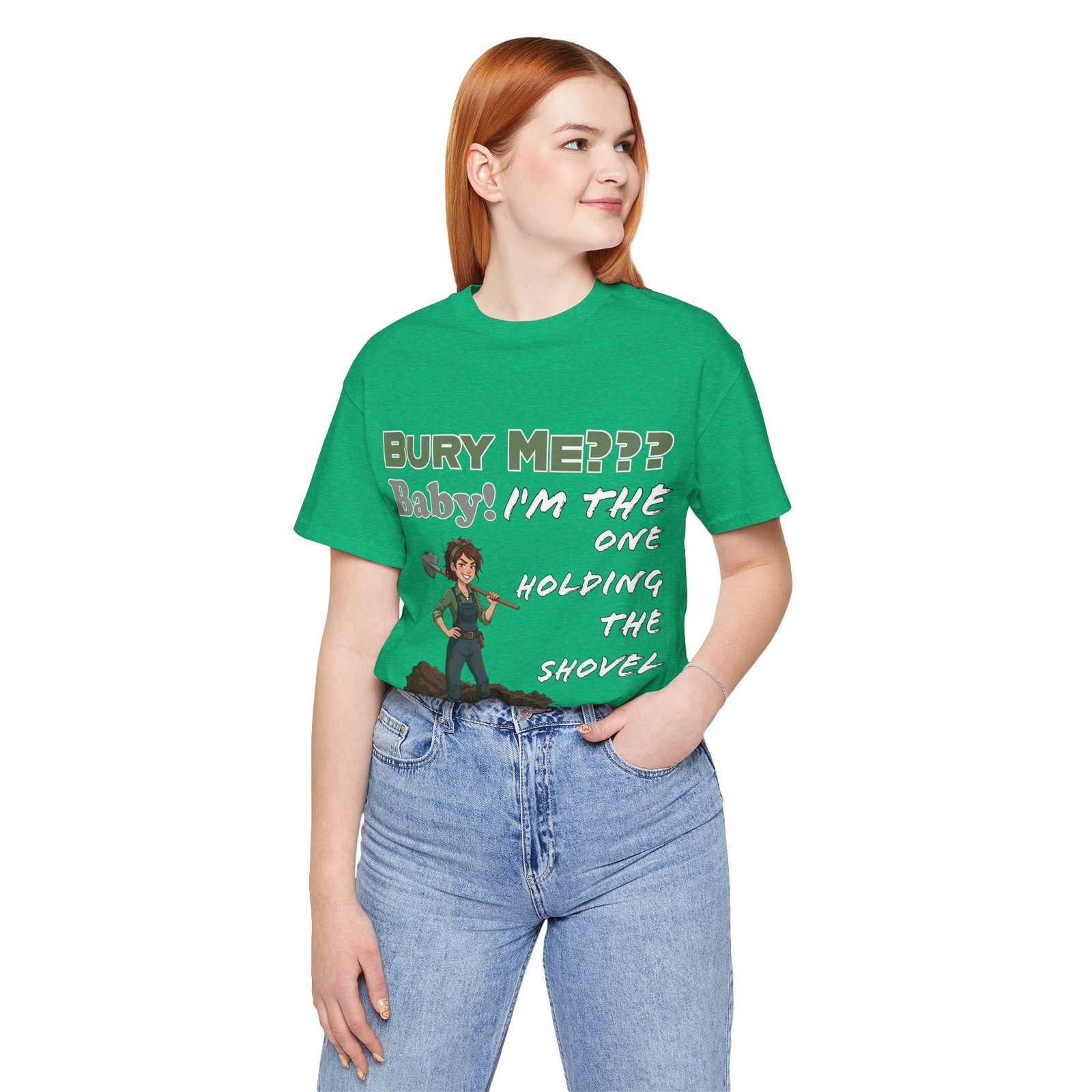 Woman wearing a green t-shirt with a dark humor graphic of an illustrated character and text "Bury Me??? Baby! I'm the One Holding the Shovel"