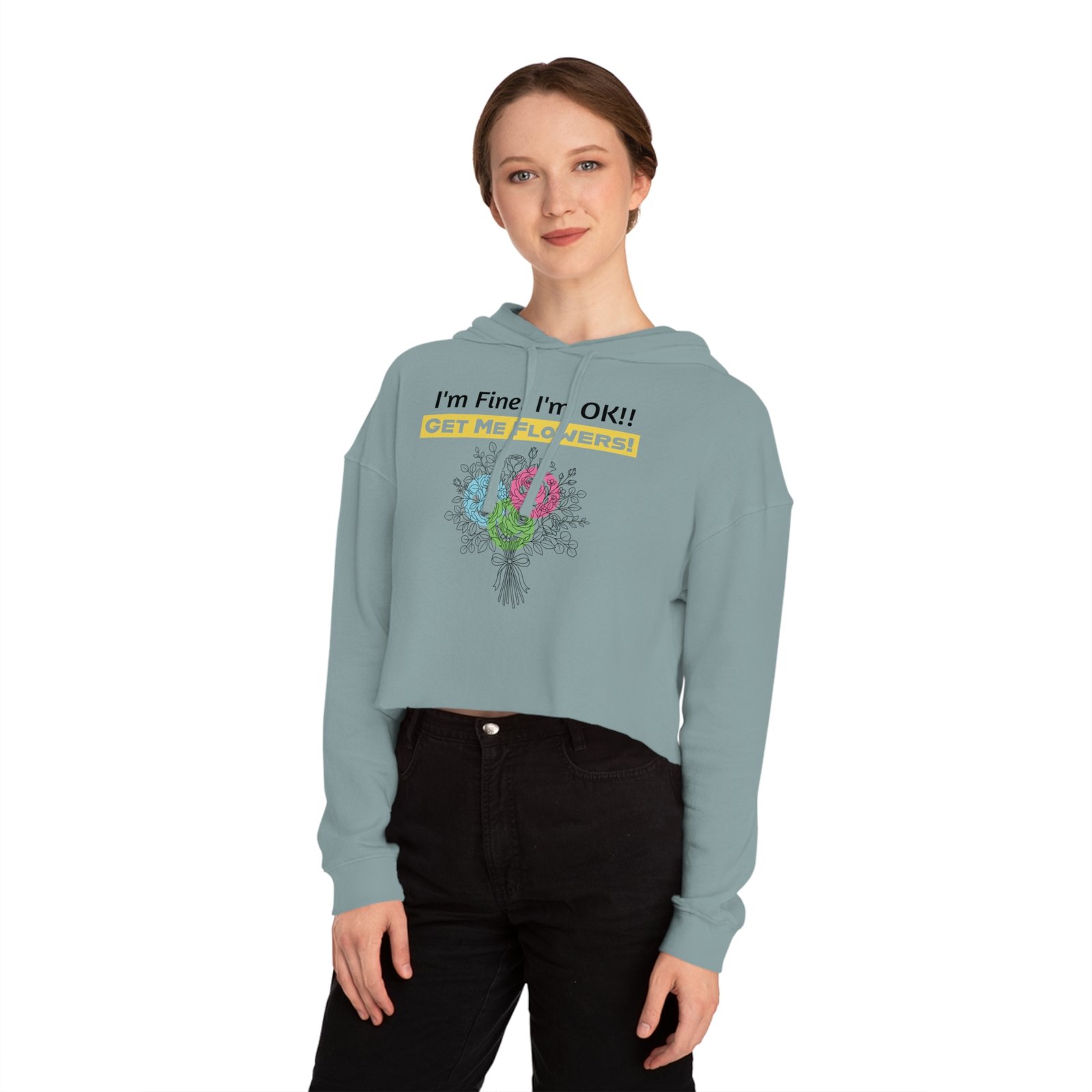 Woman wearing a light blue cropped hoodie featuring a colorful floral bouquet and 'I'm Fine! I'm OK!! Get Me Flowers!' text.