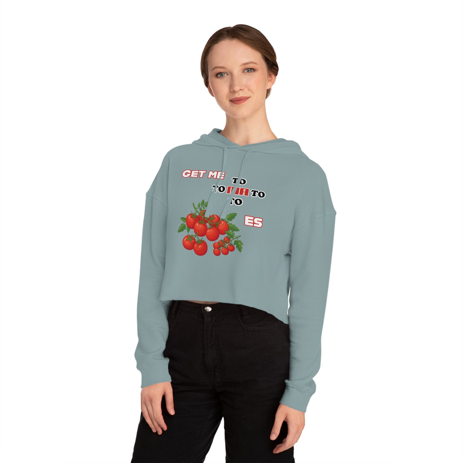 Woman wearing a light blue cropped hoodie with a tomato graphic and "Get Me to Tomatoes" text.