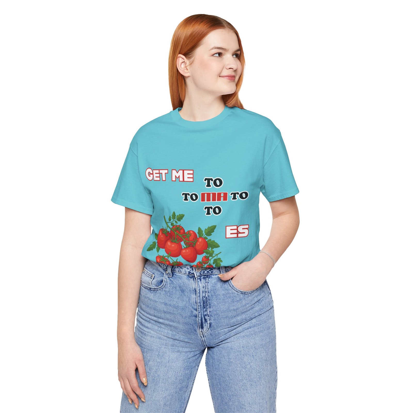 Woman wearing a light blue Get Me To Ma To Toes T-shirt featuring red tomato clusters and retro typography.