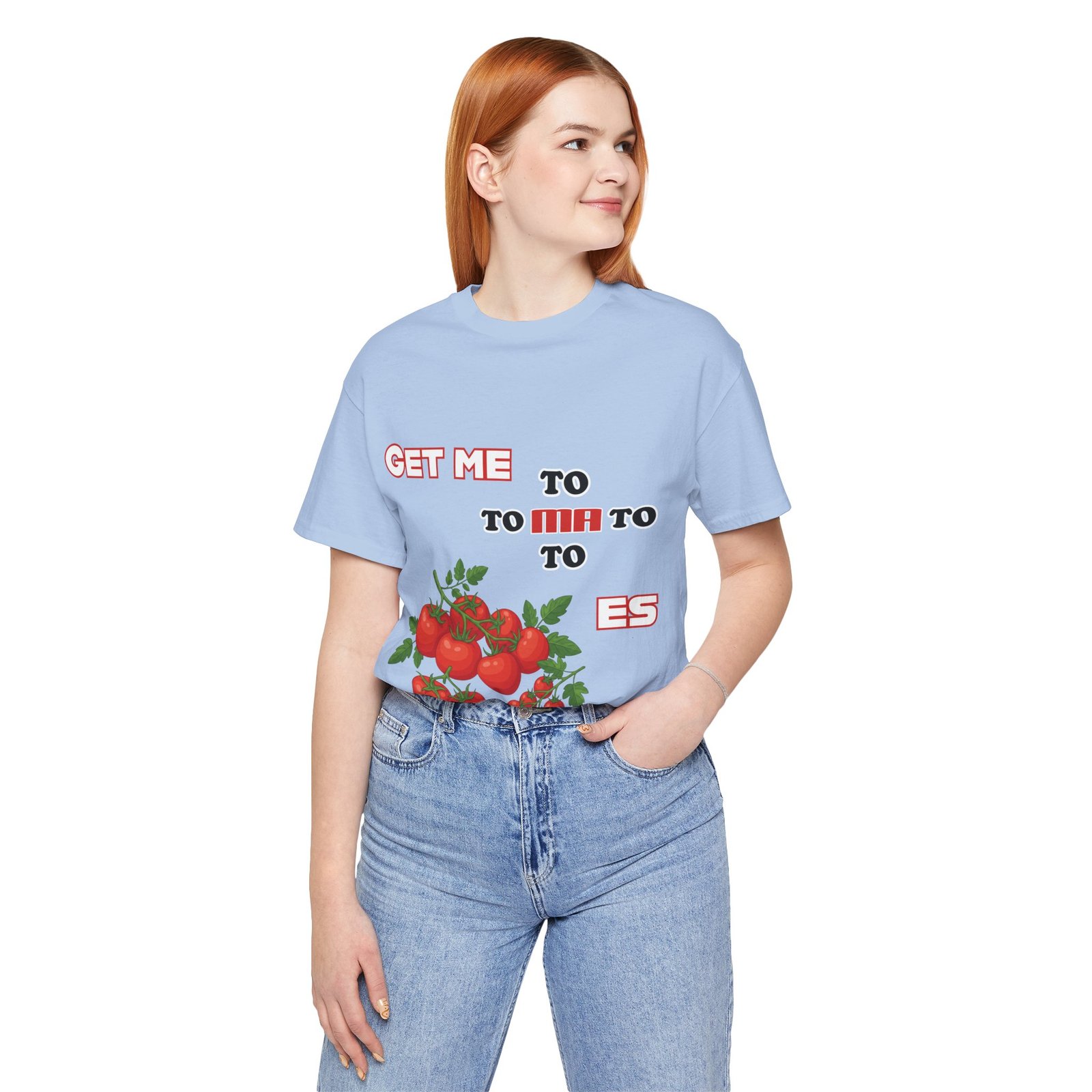 Woman wearing a light blue 'Get Me To Ma To Toes' t-shirt featuring vintage tomato illustrations and retro typography.